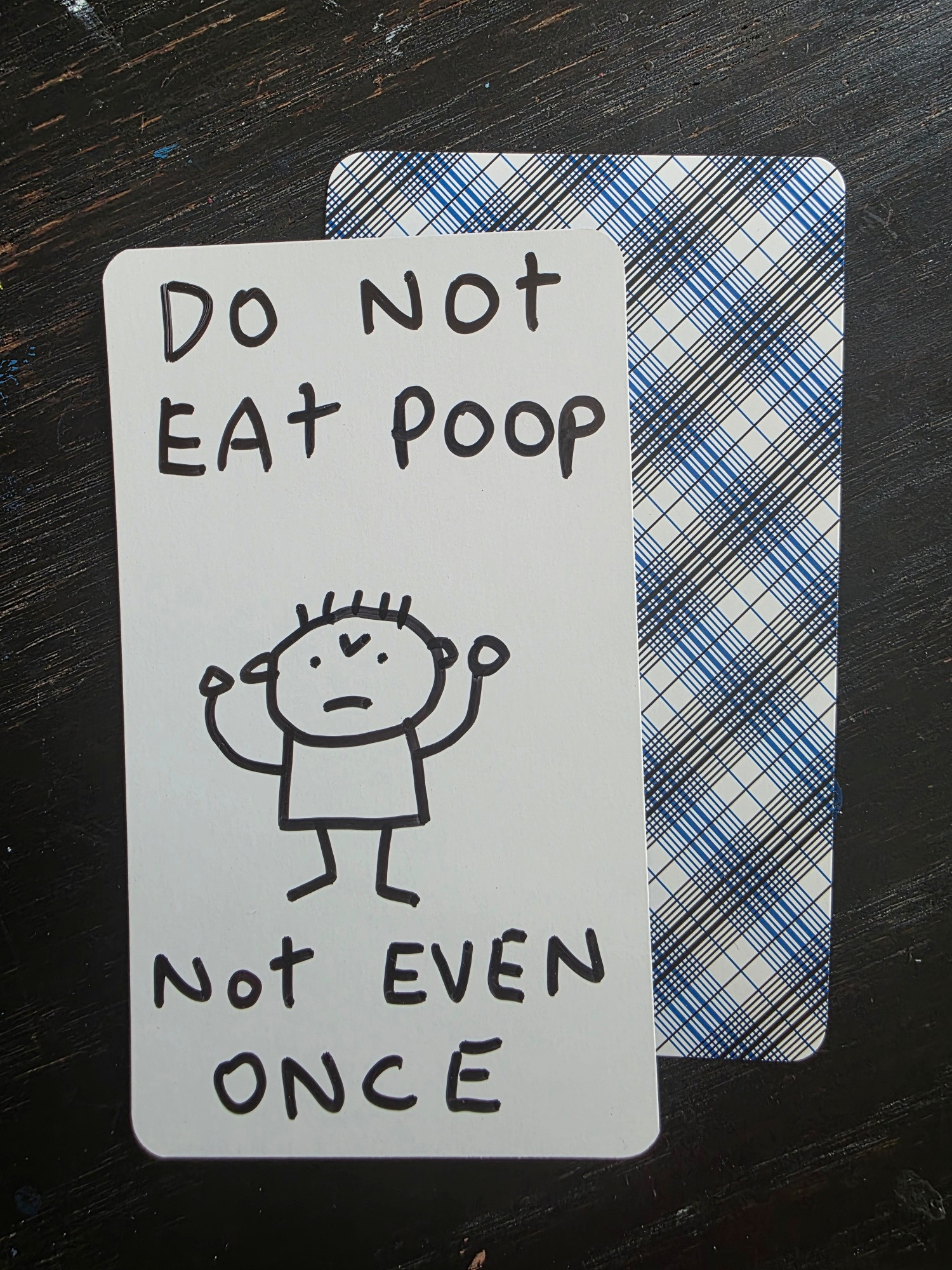 DO NOT EAT POOP - NOT EVEN ONCE and an angry stick figure. Drawn on a blank tarot card.