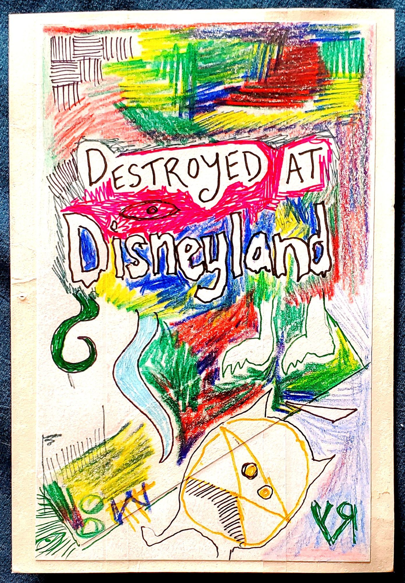 Scribbled nonsense with the words "Destroyed At Disneyland" and a couple of sketchy monsters...