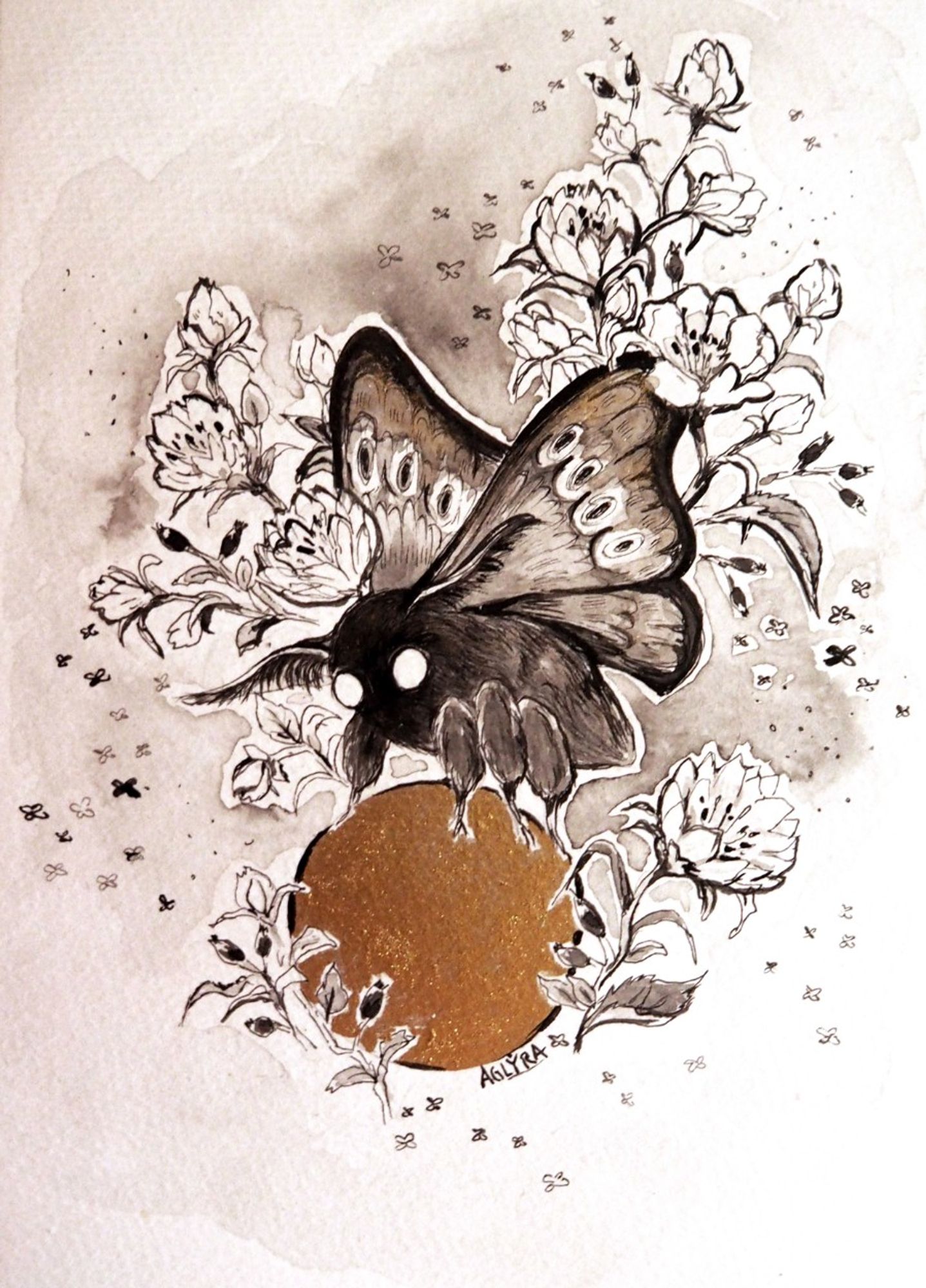 Inkpainting - a black moth with floral elements on a golden round object. Painted by aglyra