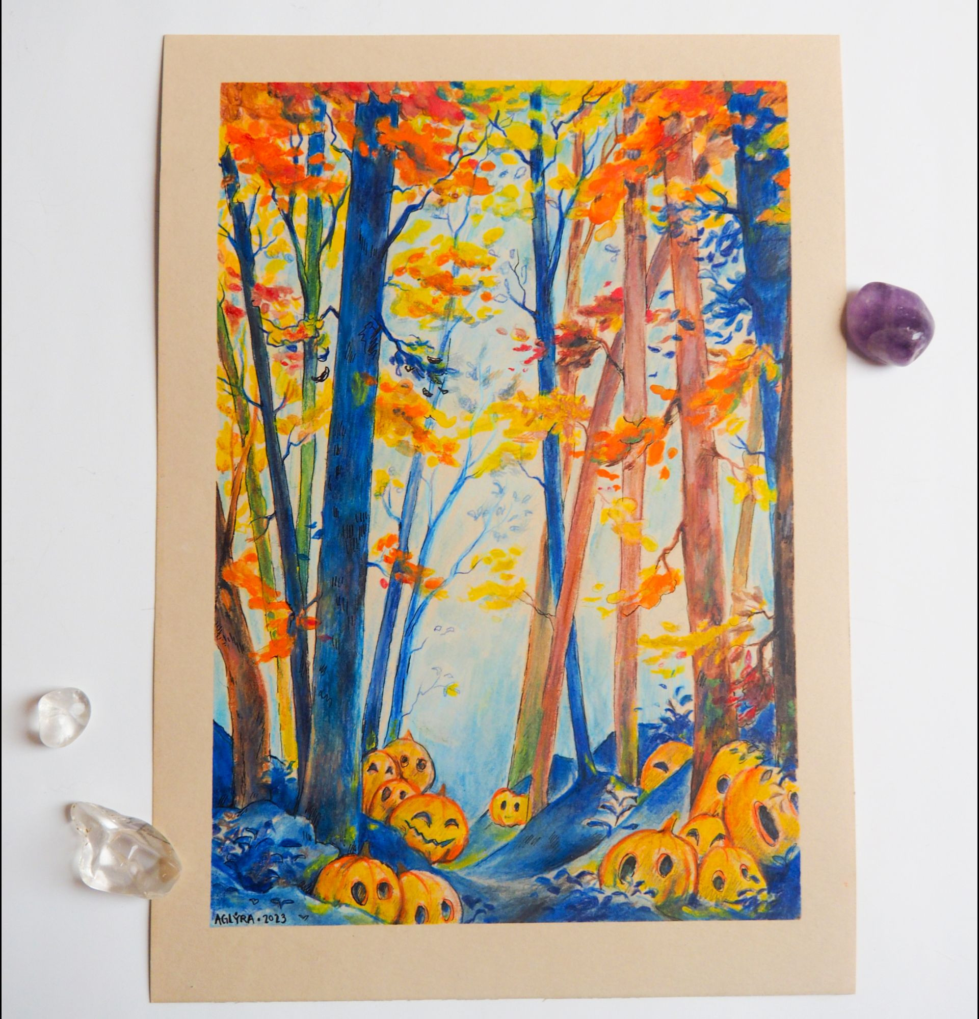 Picture of an illustration: The painting shows blue and orange-brown trees and pumpkins on the ground.