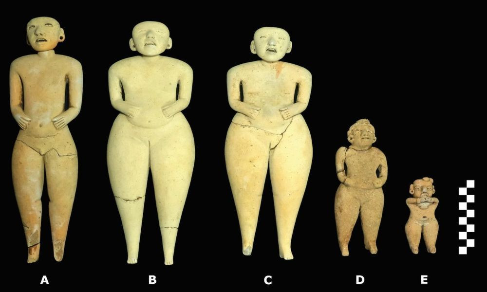 Five ceramic humanoid figurines with expressive faces and movable, articulated heads.
