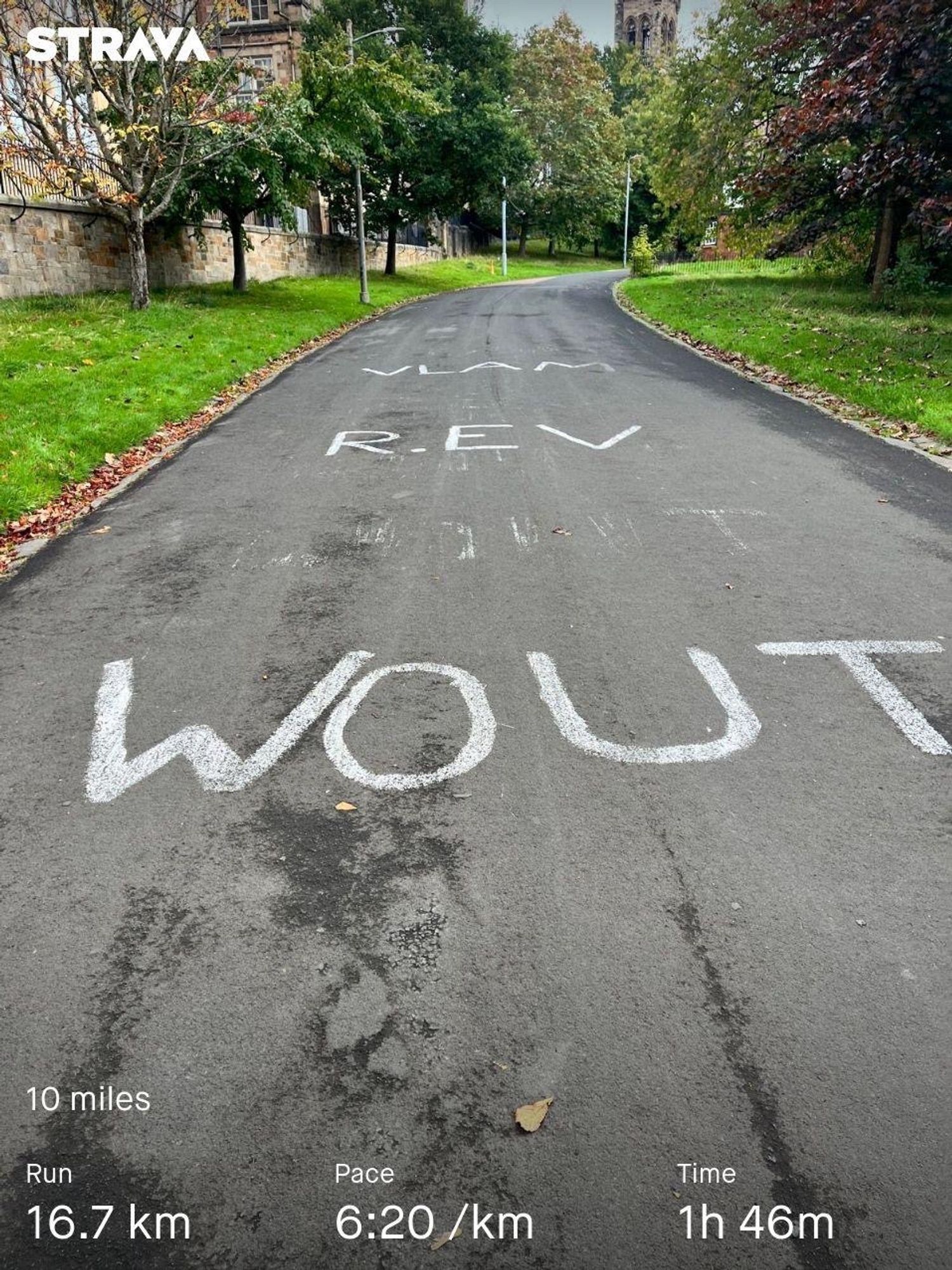 A photo of one of the paths in Kelvingrove Park that still has Vlam, R. Ev, and Wout painted on it in white following the UCI Cycling Championships in Glasgow last year.

Strava stats along the bottom show a 16.7km run in 1 hour 46 mins