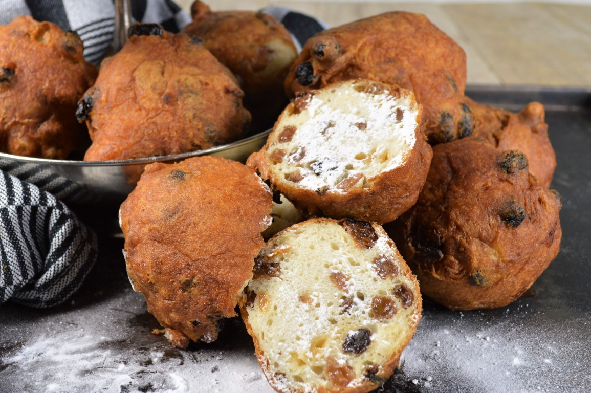 A collection of 'Oliebollen', a Dutch new years snack. It is deep fried dough with raisins.