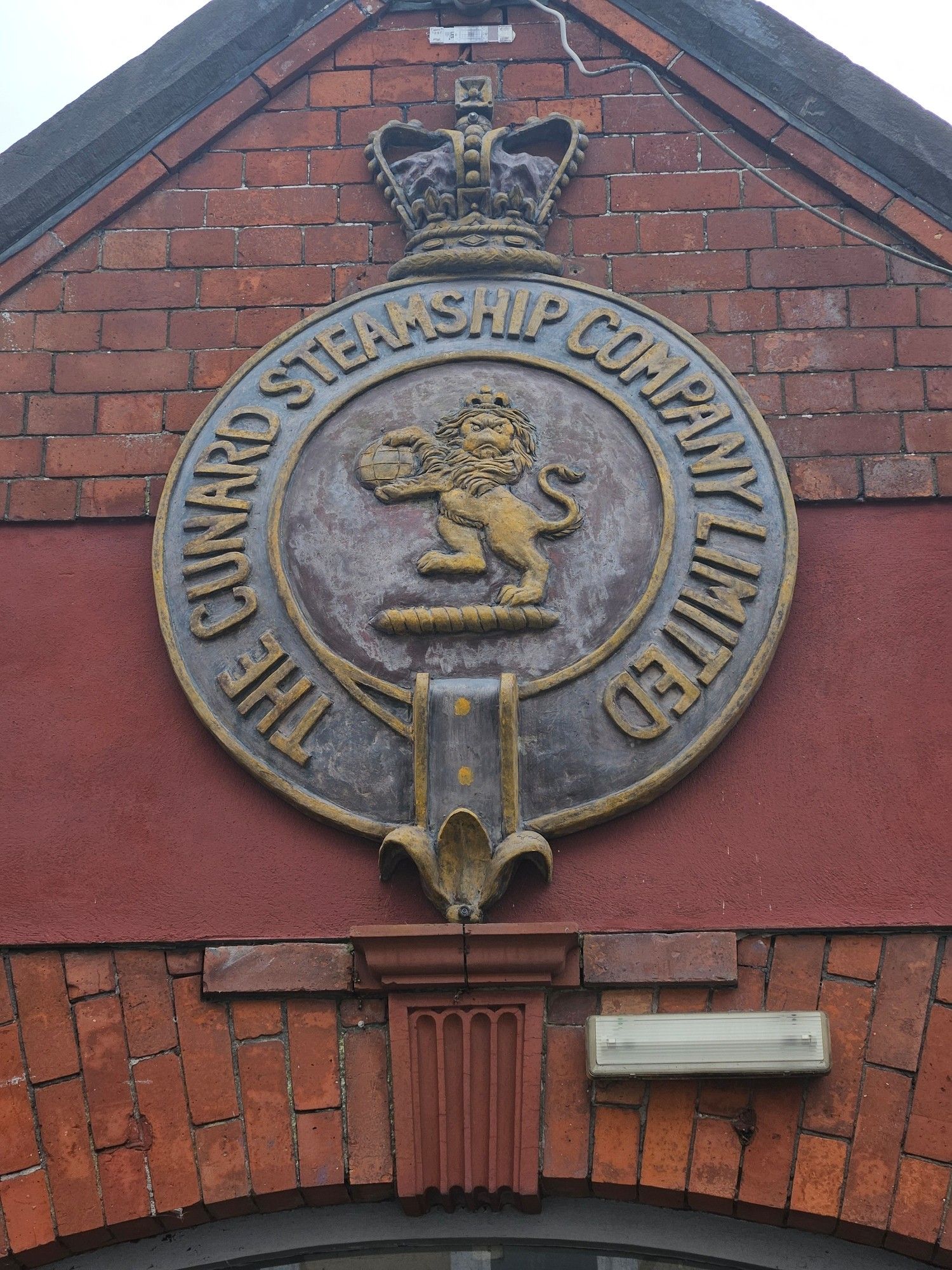 Cunard company crest on their office and embarkation point in Cobh