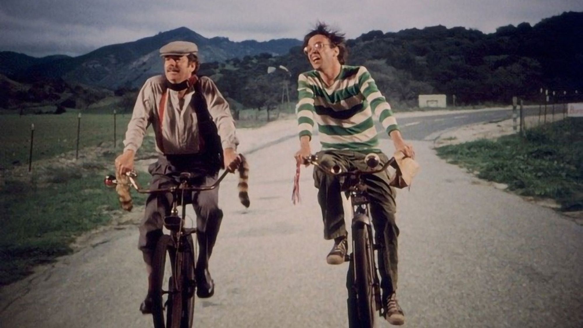 Russ Tamblyn and Neil Young on bicycles