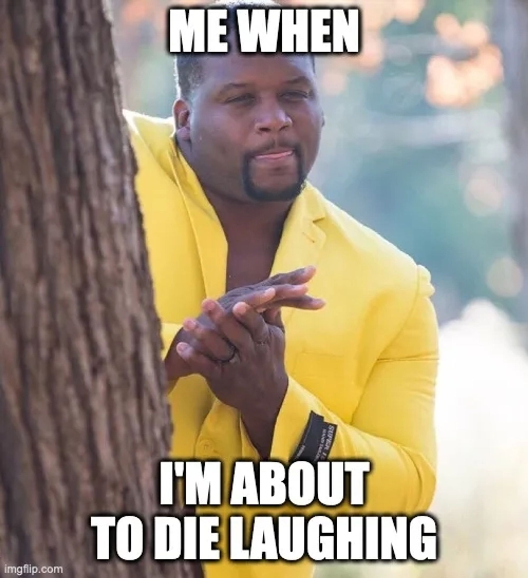 A meme of a Black man with a goatee in a yellow suit jacket. He is rubbing his hands together and licking his lips. The caption reads "me when I'm about to Die Laughing"