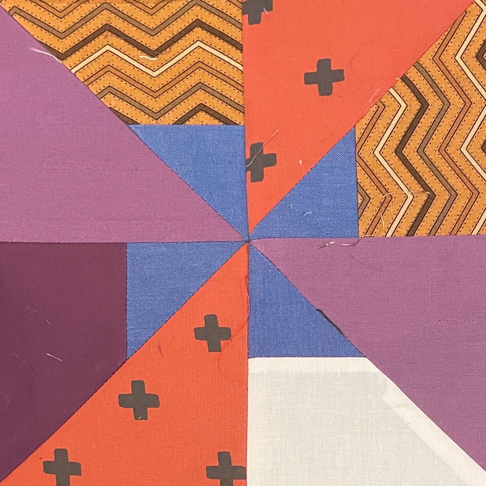 these 4 pictures are just geometric sample blocks I sewed from fabric I had lying around and then mockups where I tile them to figure out if I enjoy how they look or not