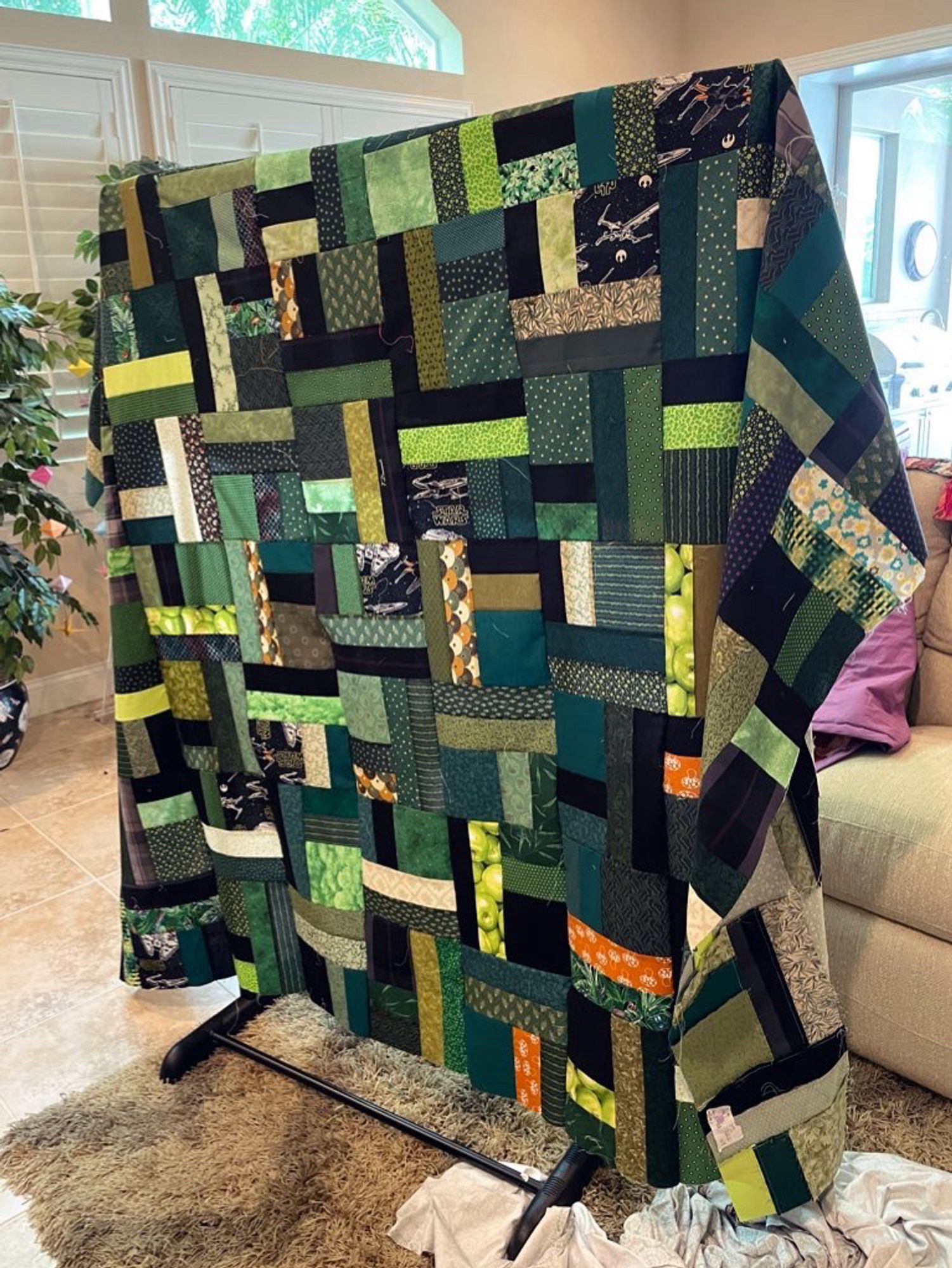 Green "jelly roll twist" quilt top I've been piecing on stream