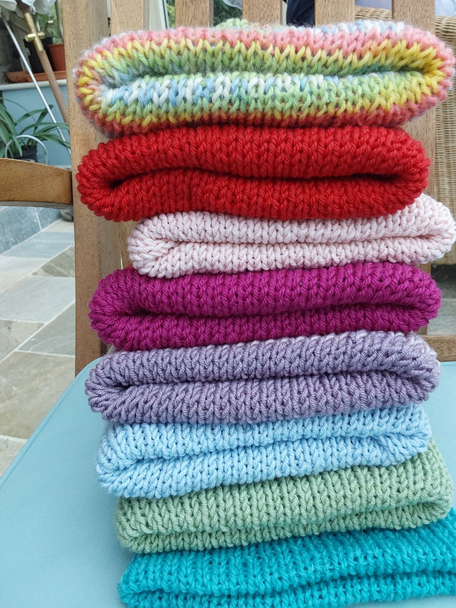 A pile of double-thickness hats in many sizes and many colours