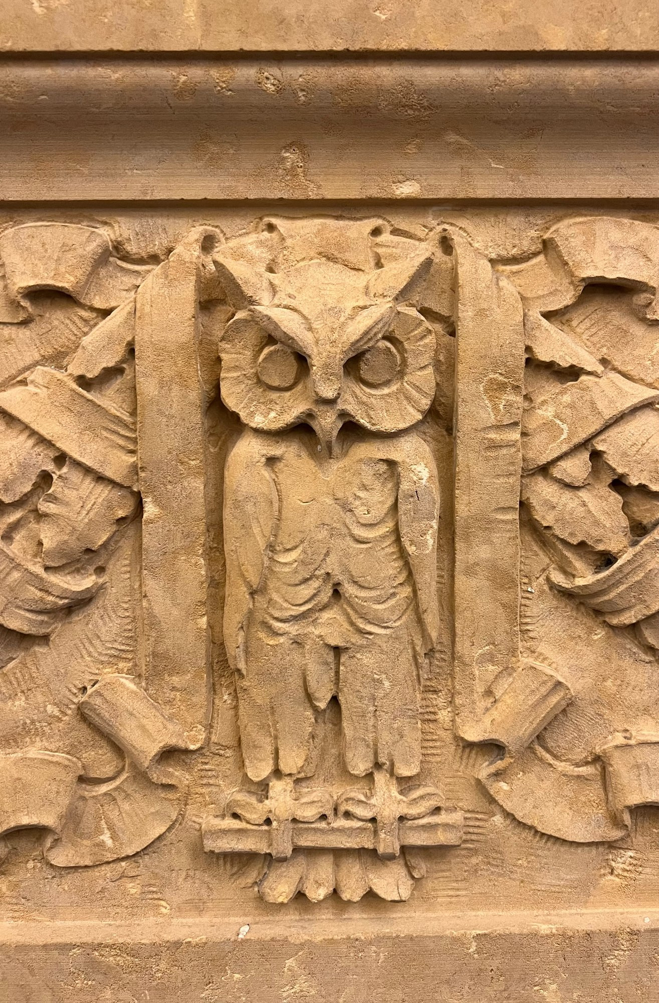 Owl carved into stone.