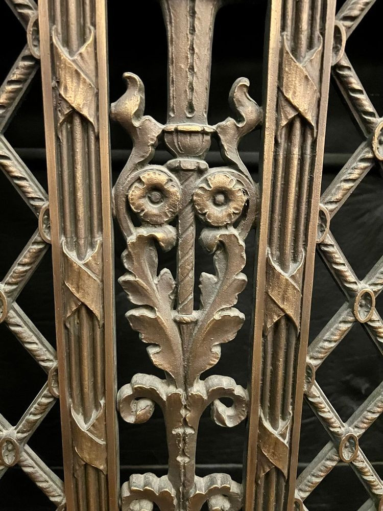 Owl sculpted into a heating grate.