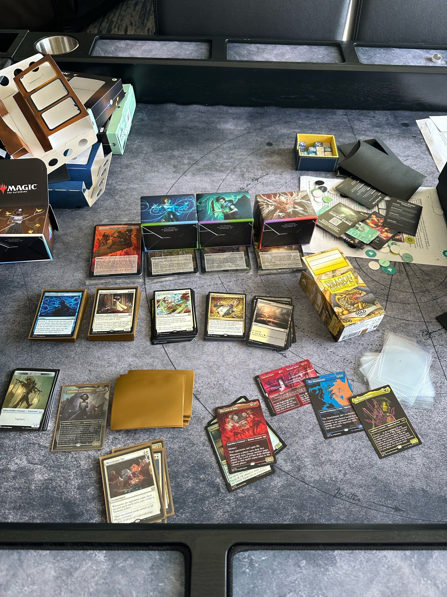 Picture of a gaming table with magic cards in the process of being sleeved