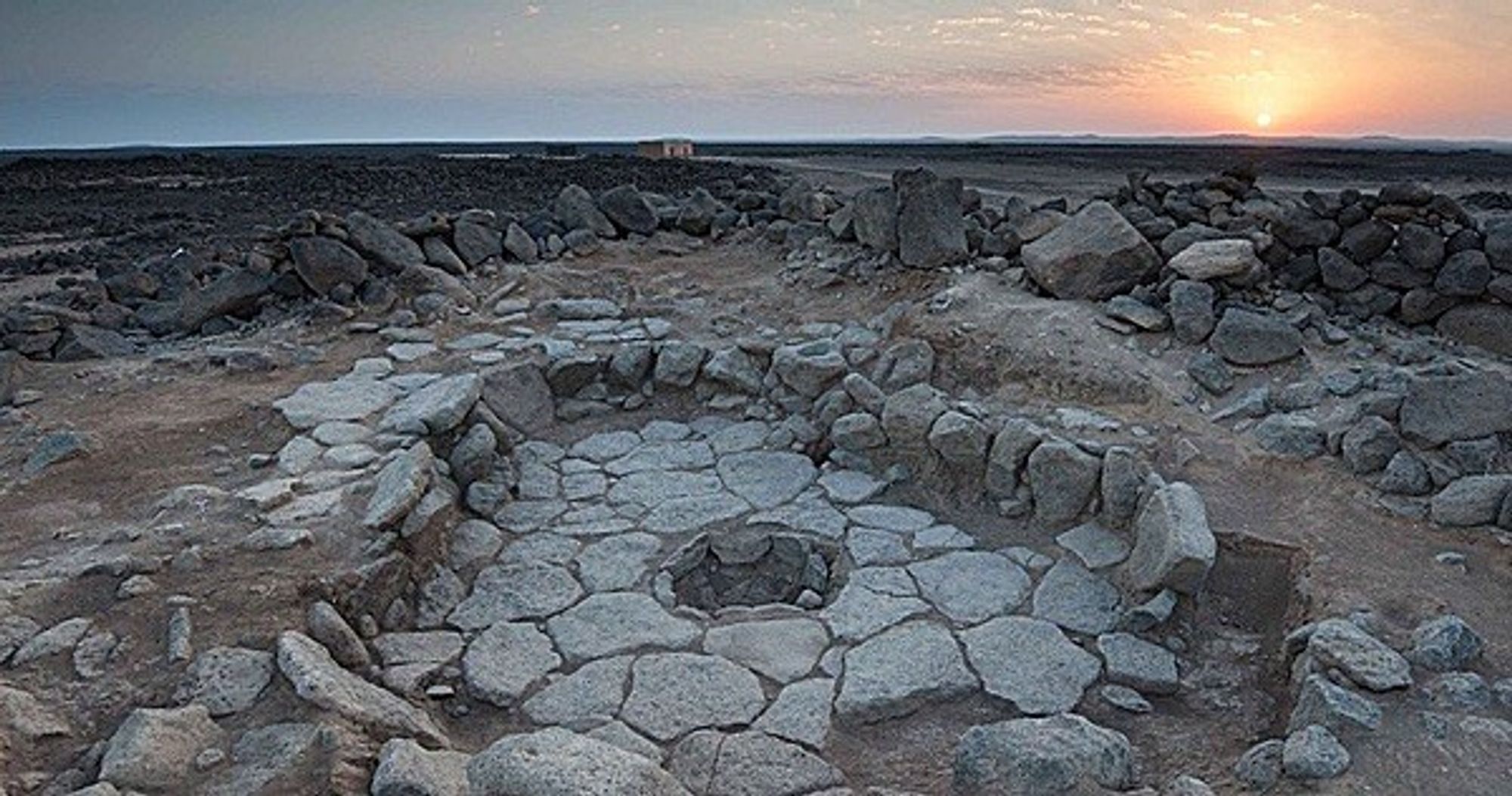 Excavation of a Natufian dwelling. In the centre of a paved area is a fire pit where the world’s oldest breadcrumbs were found.