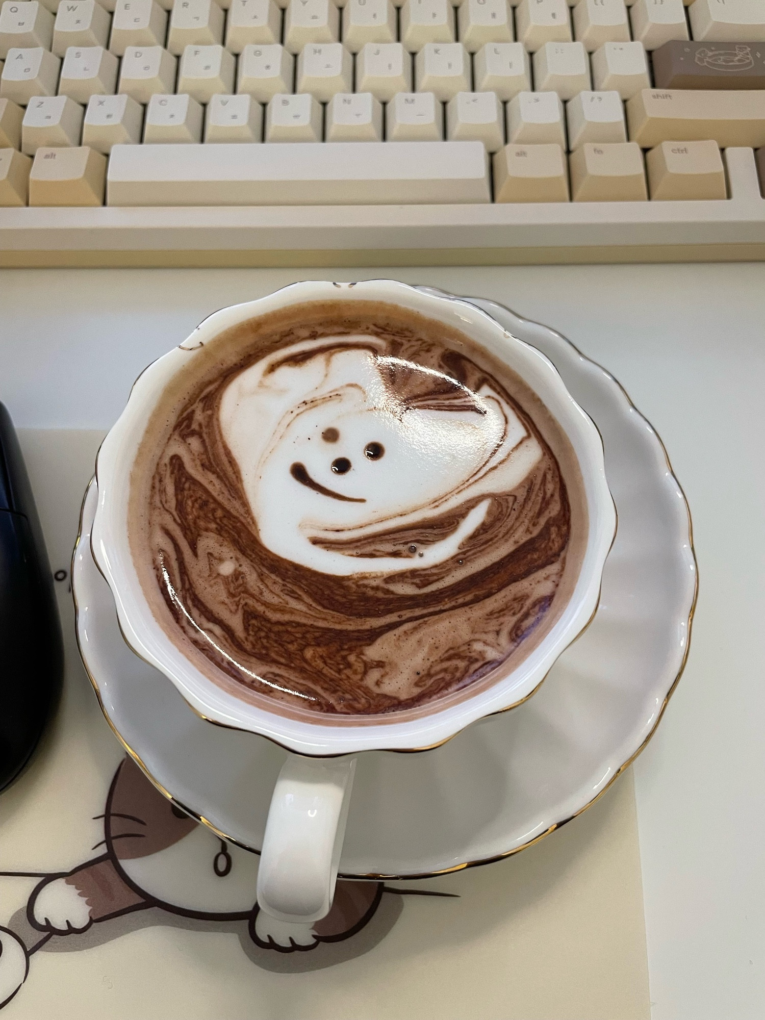 hot chocolate with a messed up heart with a smiley face in it