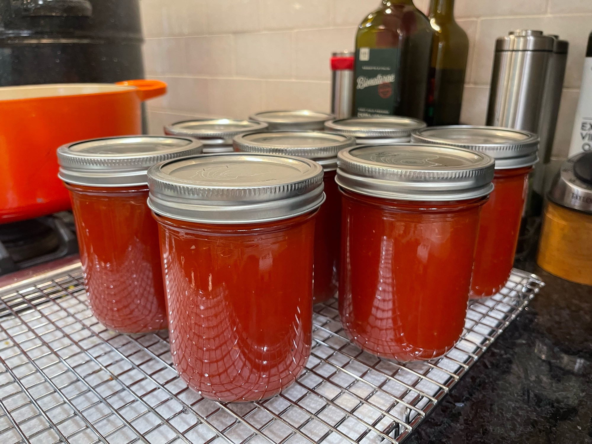 Canning jars filled with vodka sauce base