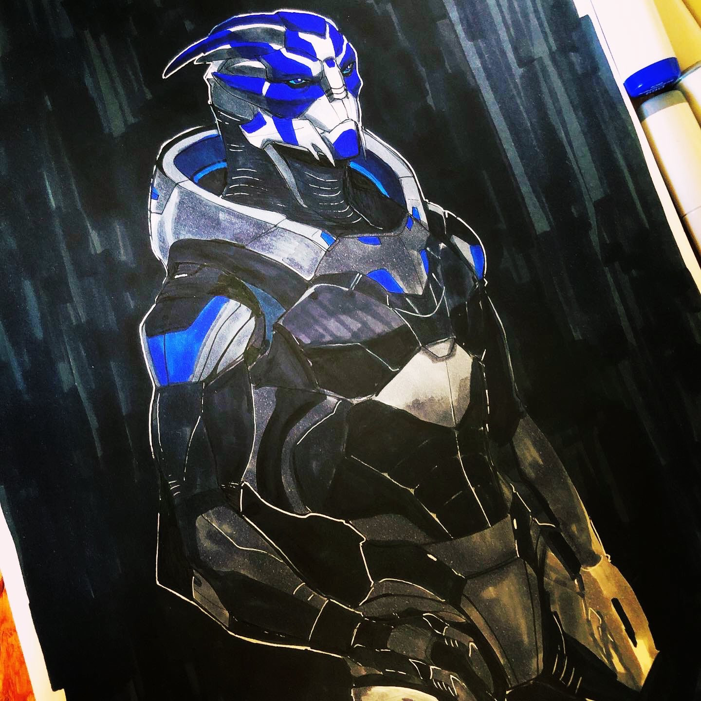A marker sketch of a turian character from Mass Effect. He’s wearing a steely blue, black and grey armor and has a stark face paint in cobalt blue.