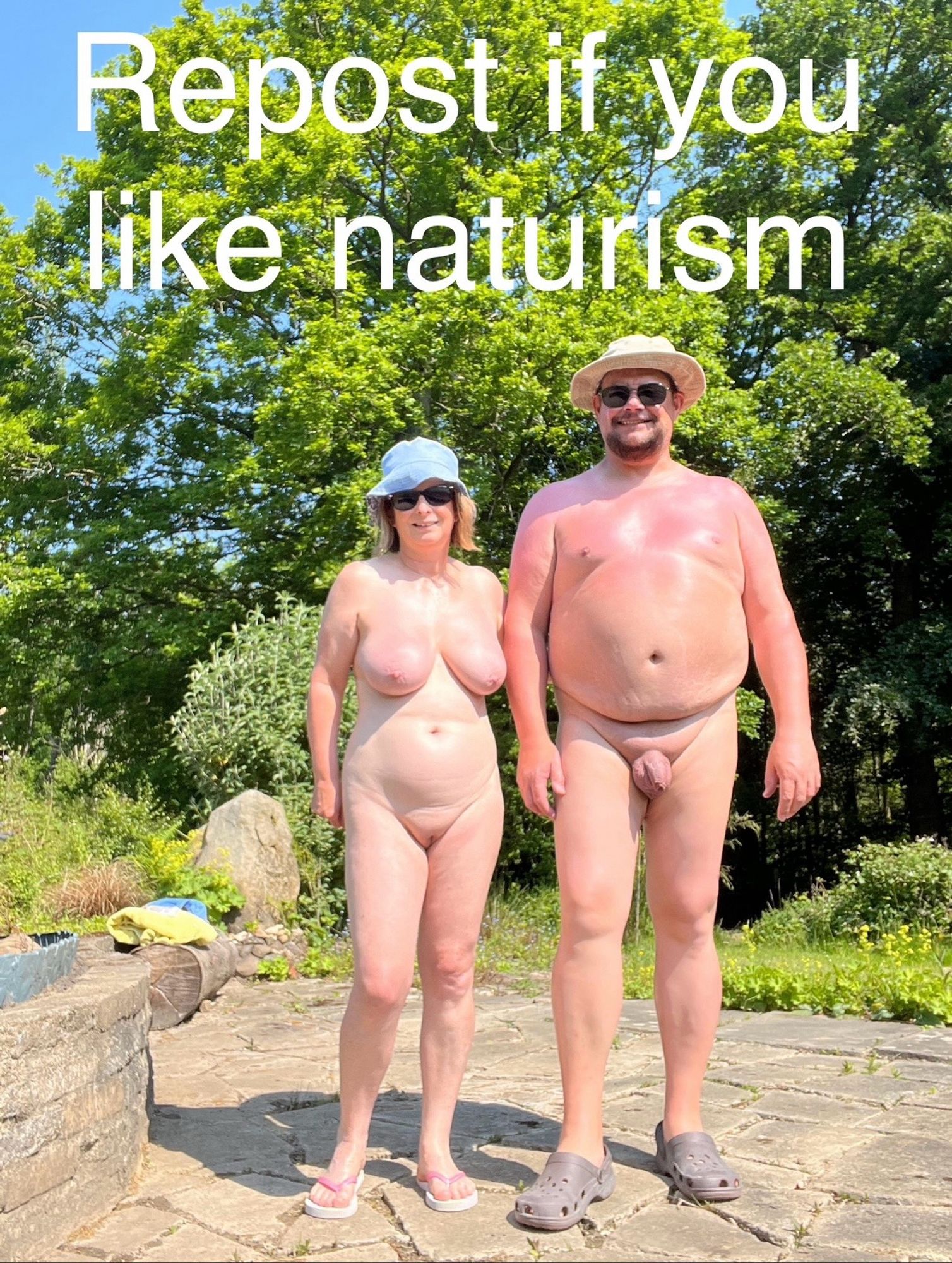 A naturist couple outside.