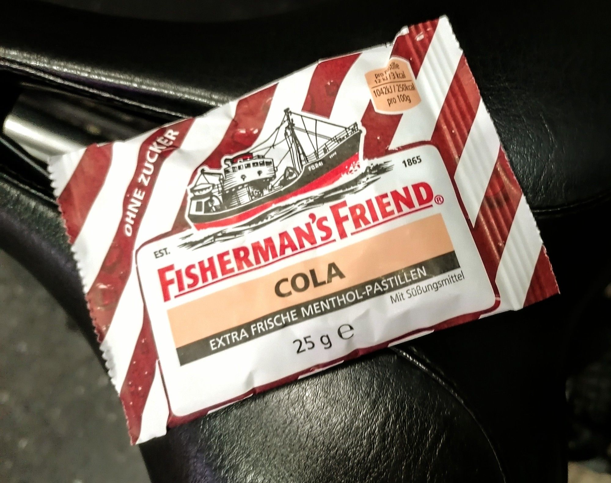 Fisherman's Friend Cola, white paperbag with brown stripes