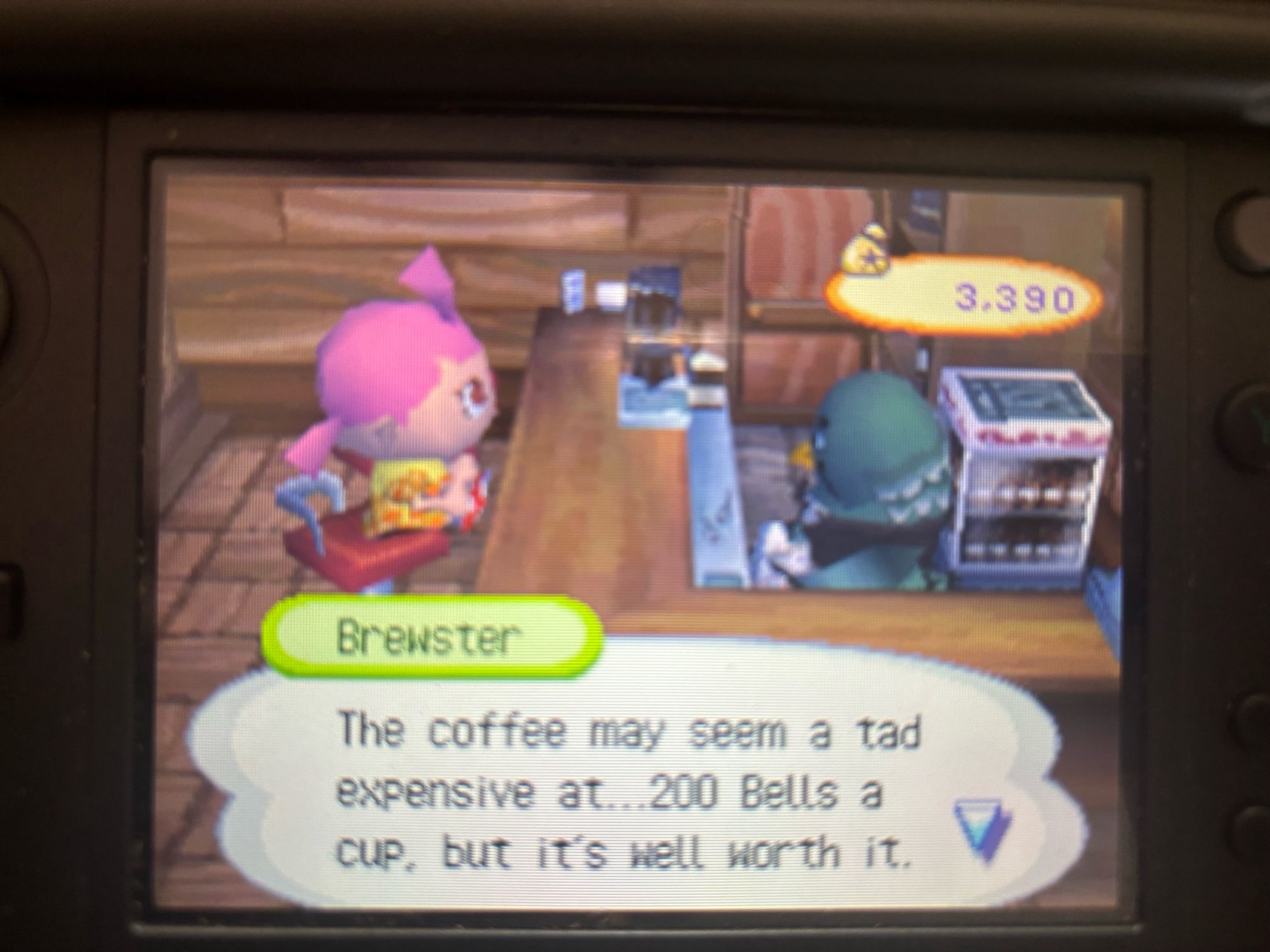 Pink haired Animal Crossing character sitting at a counter being served by Brewster, the pigeon barista. Caption reads “ The coffee may seem a tad expensive at 200 bells a cup, but it’s well worth it.”