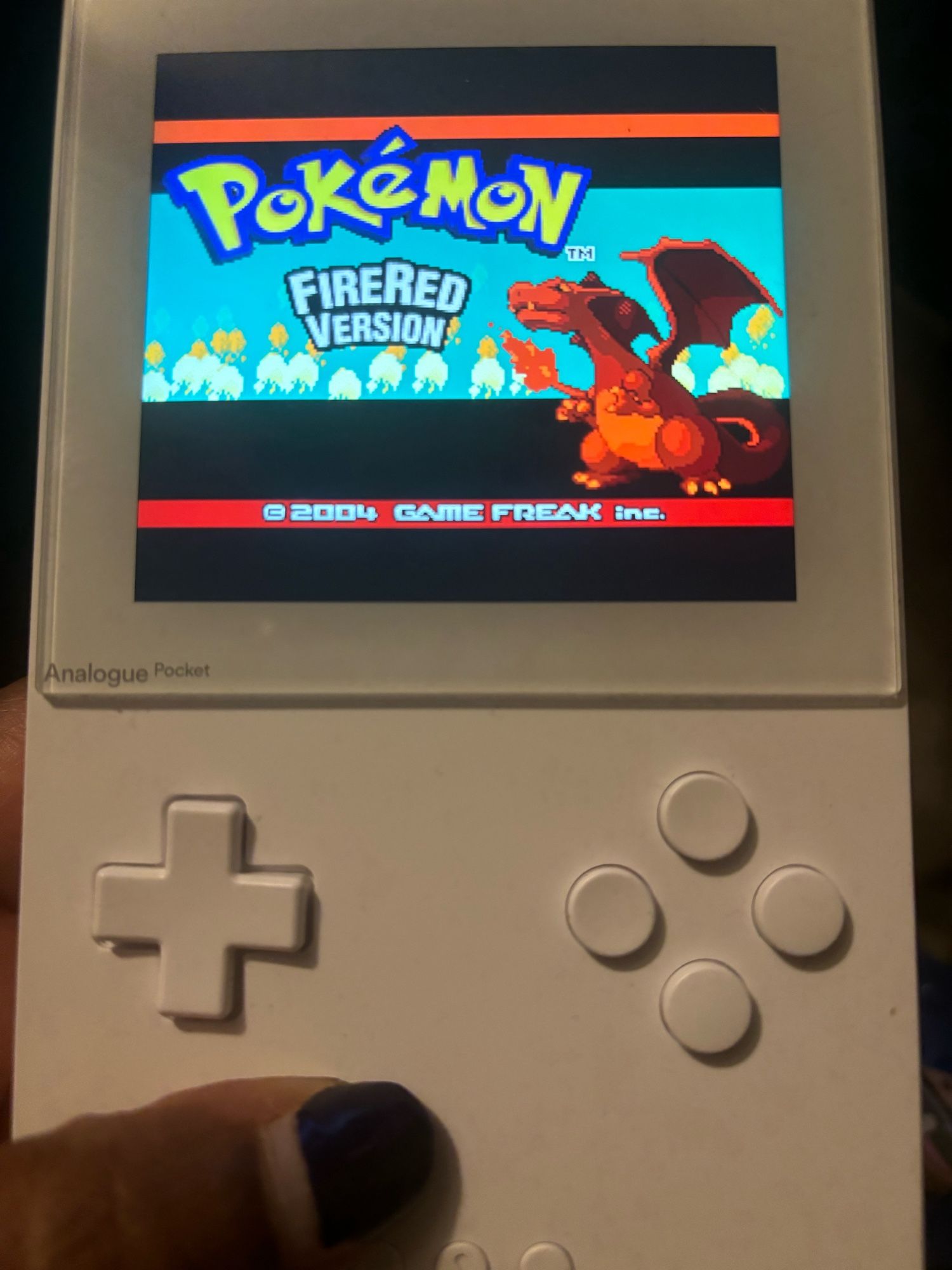 Pokémon FireRed on a white handheld (Analogue Pocket).