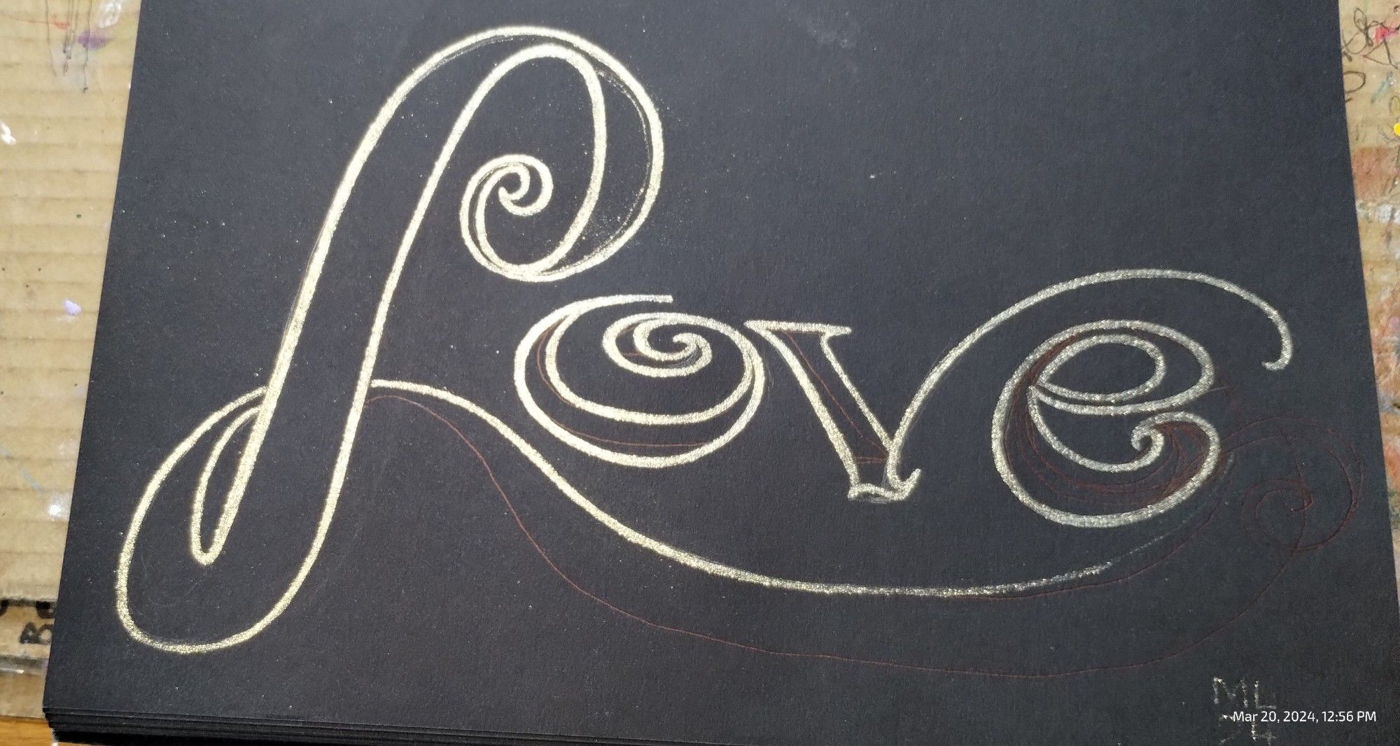 Writing 'Love' doodle in my sketchbook.
Metallic ink on black paper. Continued in next pic.
ML
24