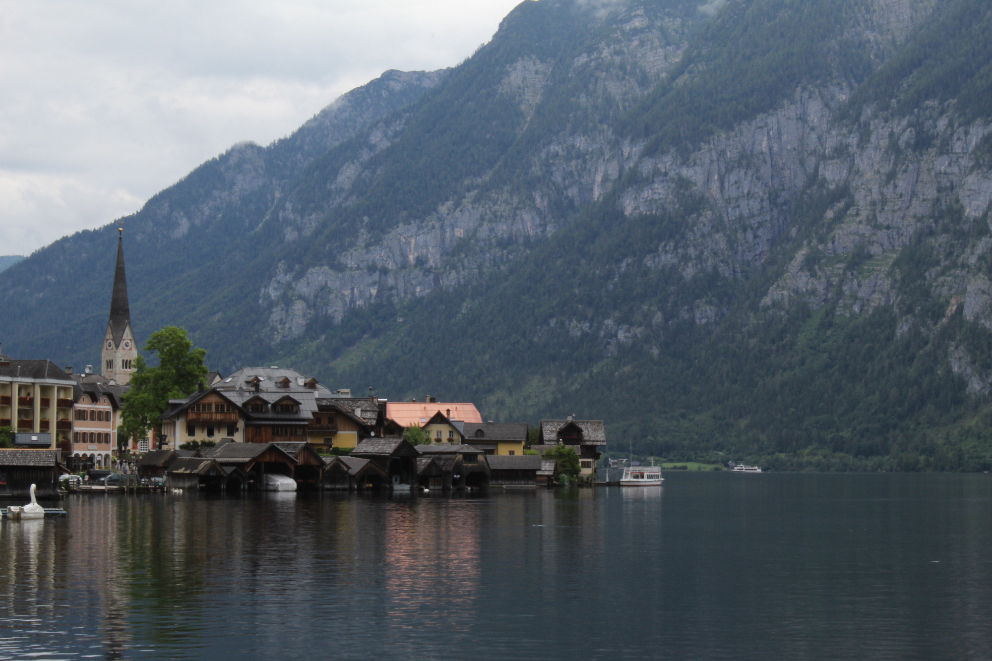 Hallstatt, Austria. A mountain rises in the background, and the lake appears in front of the town.