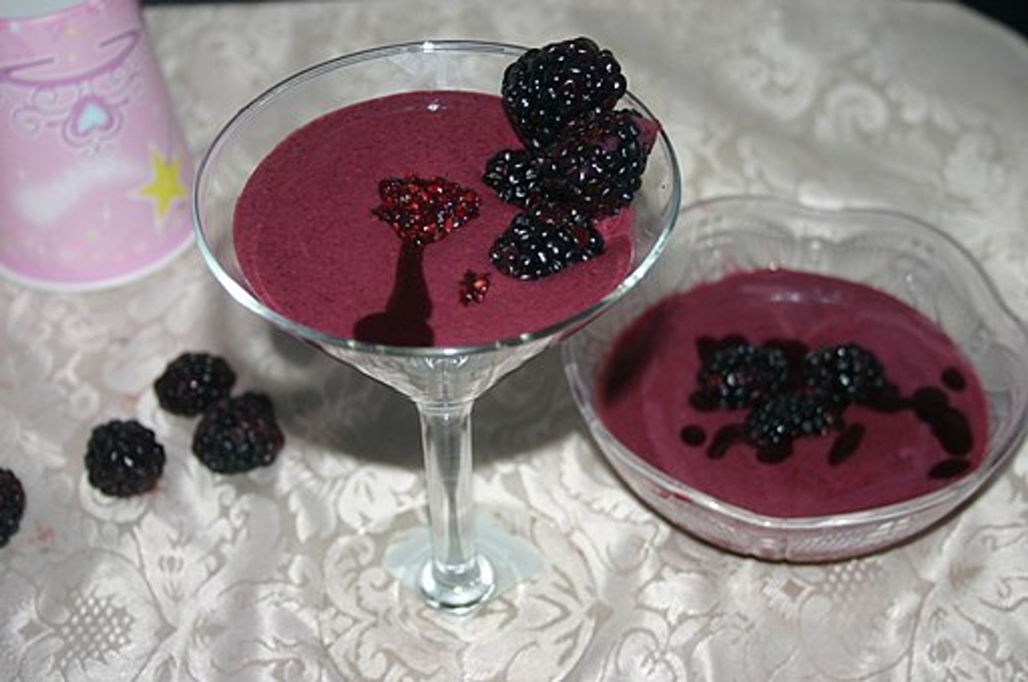 Blackberry fool dessert in a martini glass