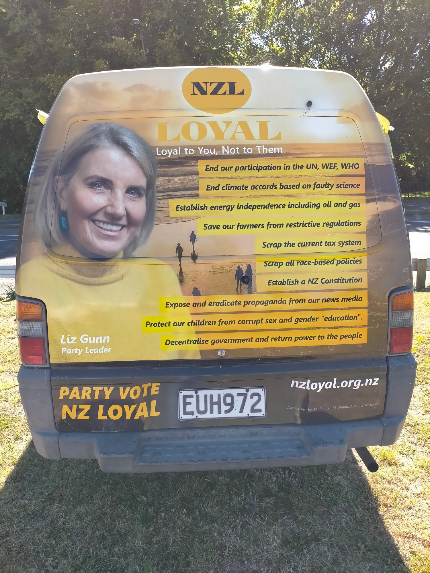 Van covered in NZ Loyal party propaganda about various conspiracy theories, with bonus pic of Liz Gunn