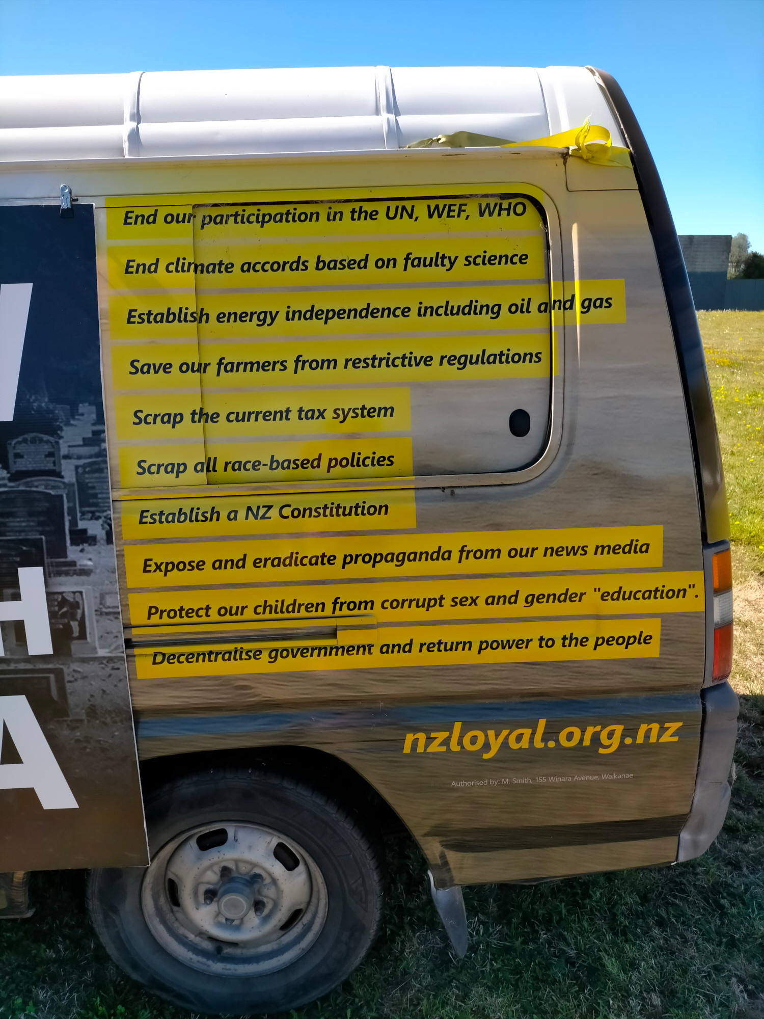 Van covered in NZ Loyal party propaganda about various conspiracy theories