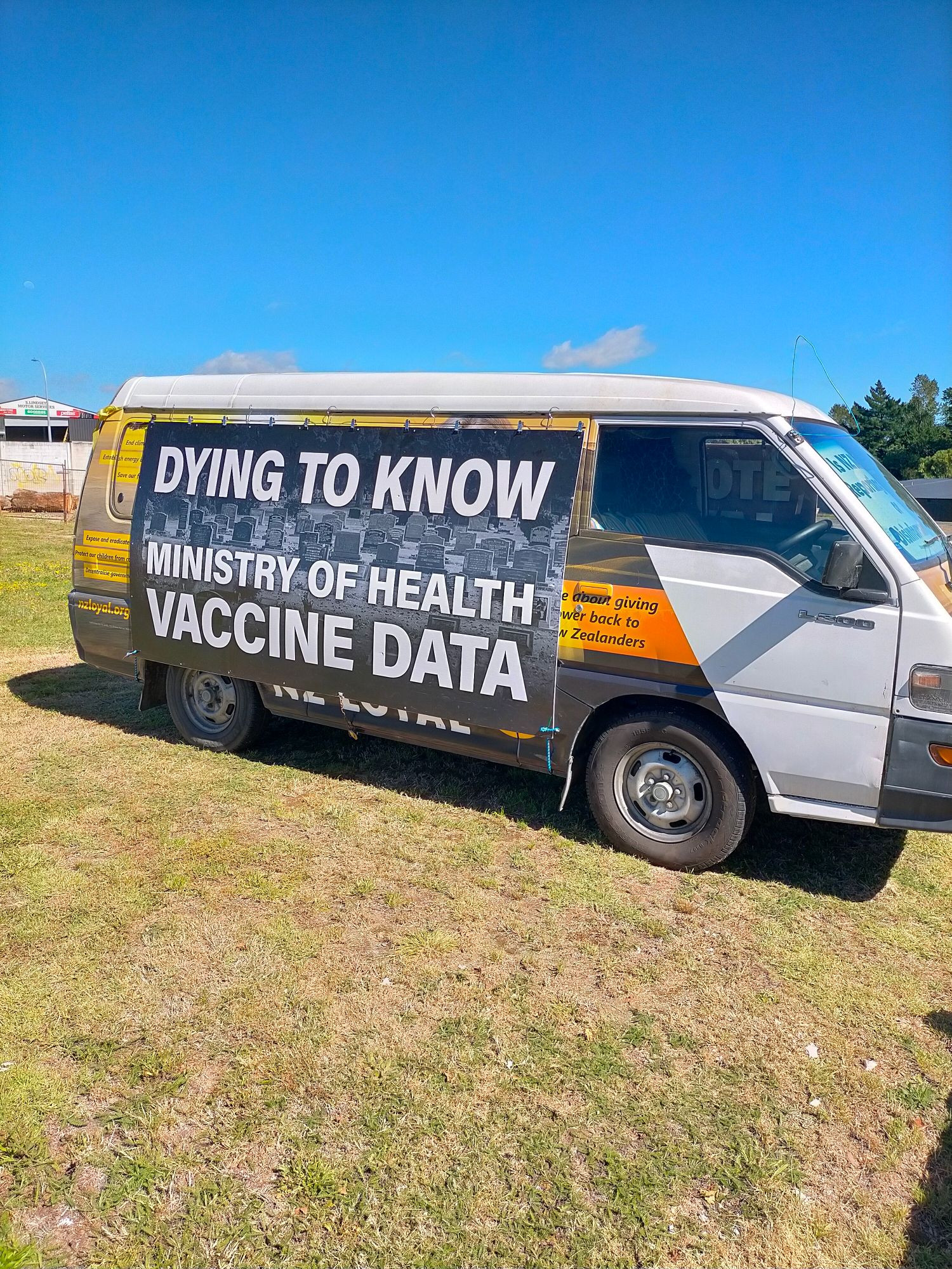 Van covered in NZ Loyal party propaganda about various conspiracy theories