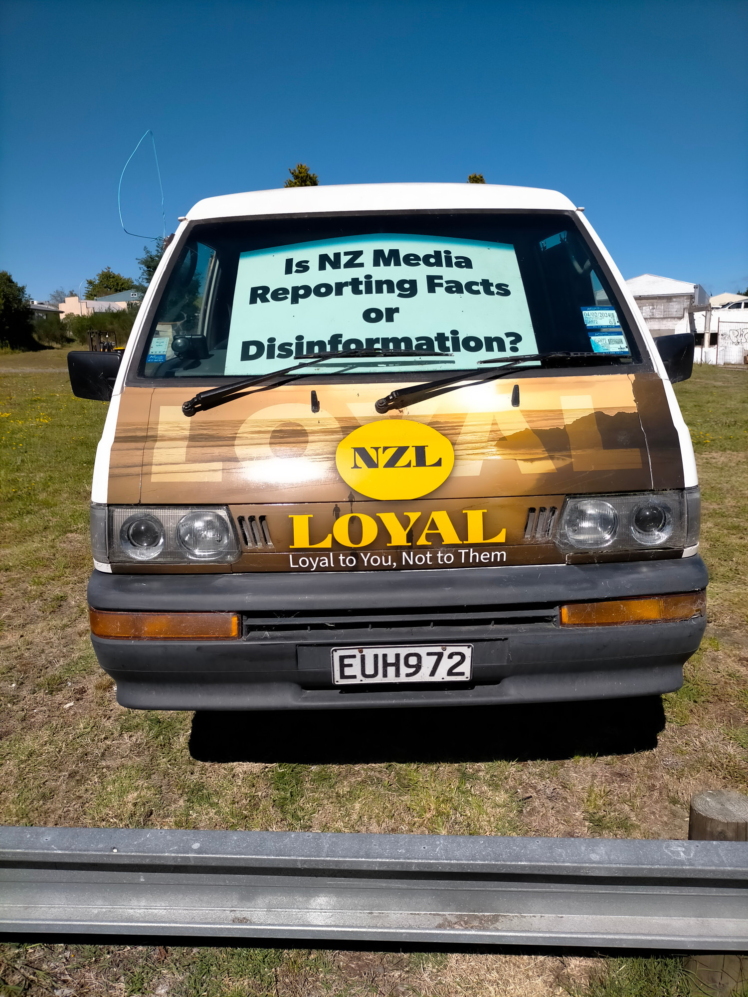 Van covered in NZ Loyal party propaganda about various conspiracy theories