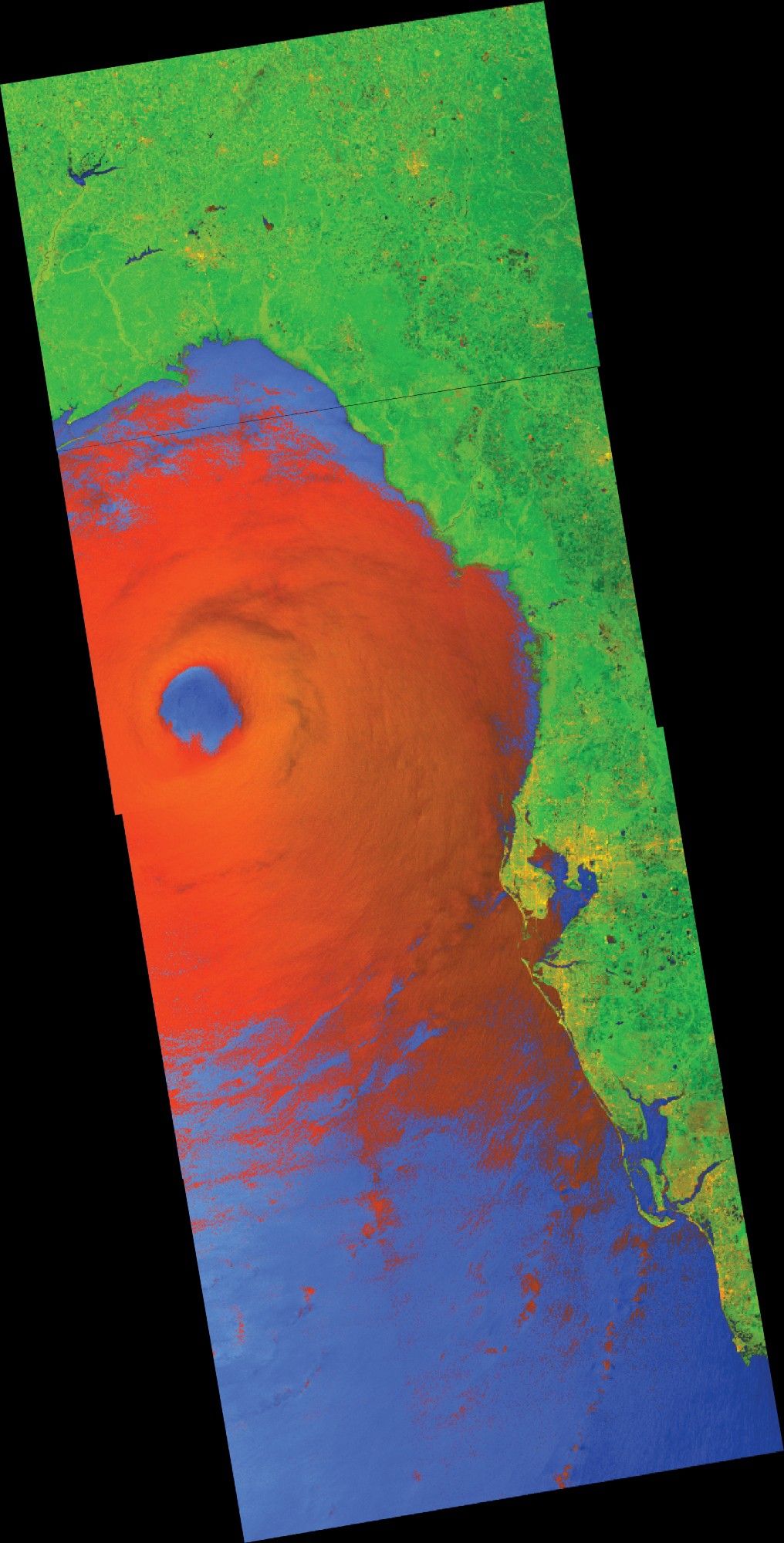 Synthetic aperture radar imagery showing Hurricane Helen on the evening of September 26.  Most land surfaces show up as green, calm water as blue, and developed areas in yellow. Region affected by strong winds/precipitation is in red within the image.  The hurricane appears as a broad region with a clear eye, right before the outer bands go on land.