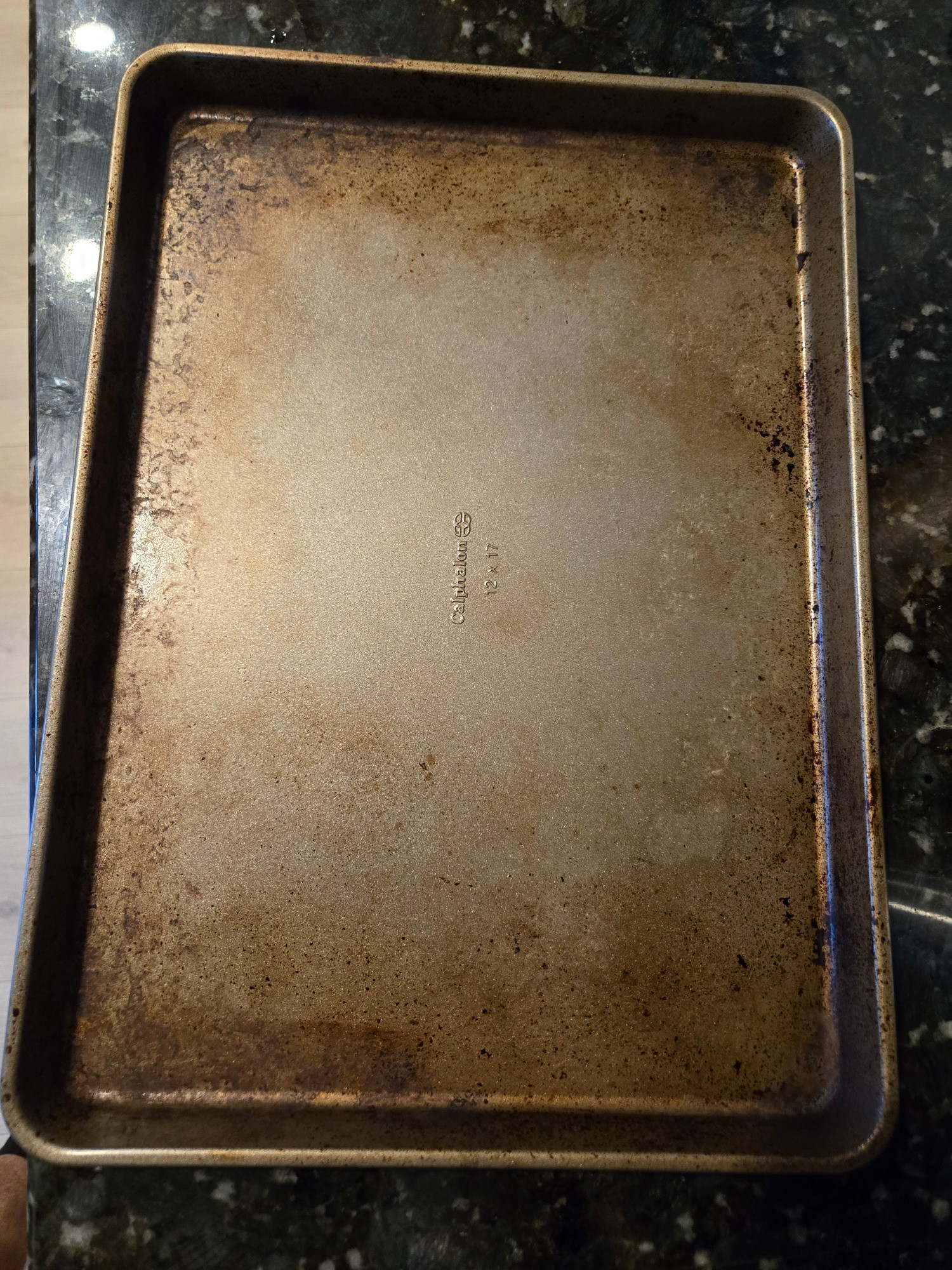 A fairly used and beaten up baking sheet that is clean enough to use 