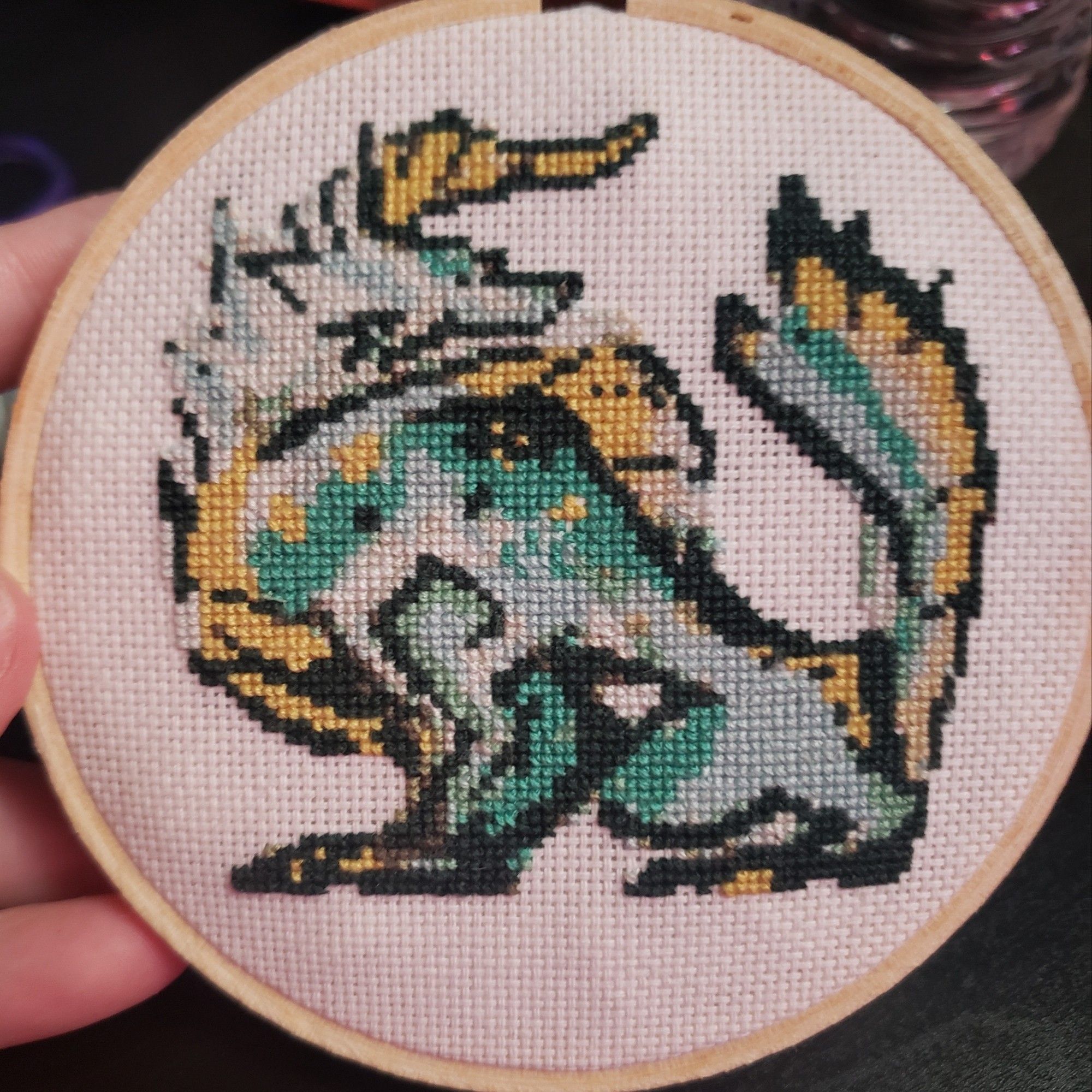 A cross stitched Zinogre icon in MH Rise's style.