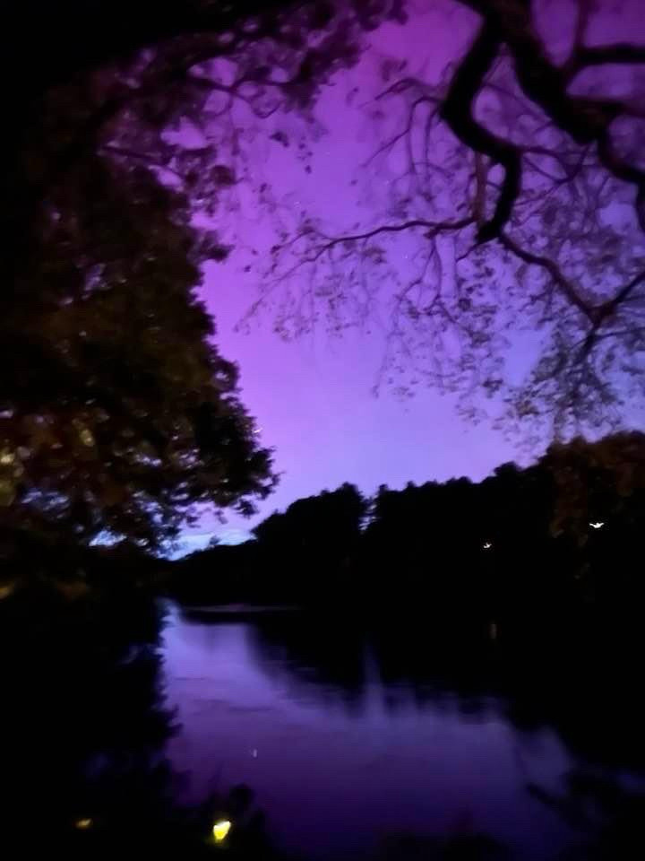 A purple sky reflected in the water of Morses Pond.