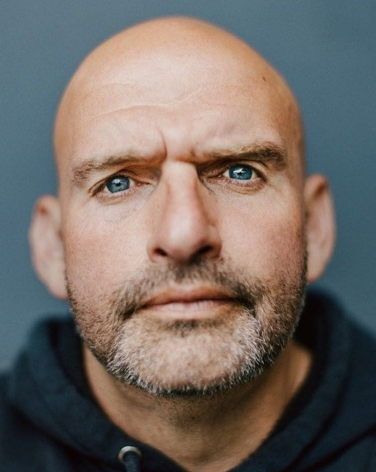 John Fetterman looking meaningfully and sentimentally into the camera with a very strong vignette blur 