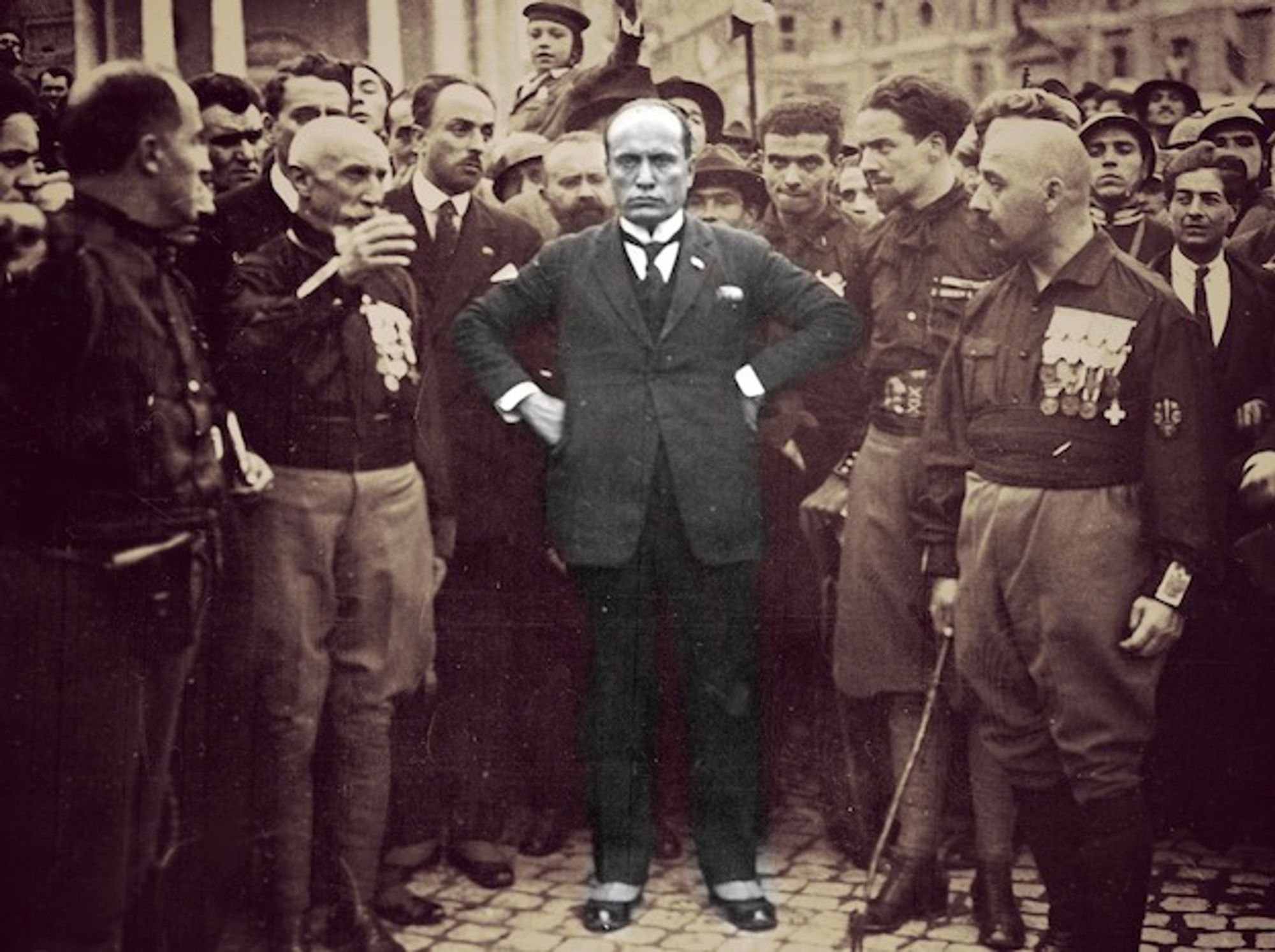 Benito Mussolini scowling