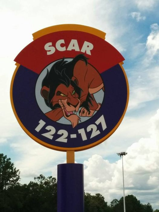 Disney World car park sign with a picture of Scar and the parking rows (122-127)