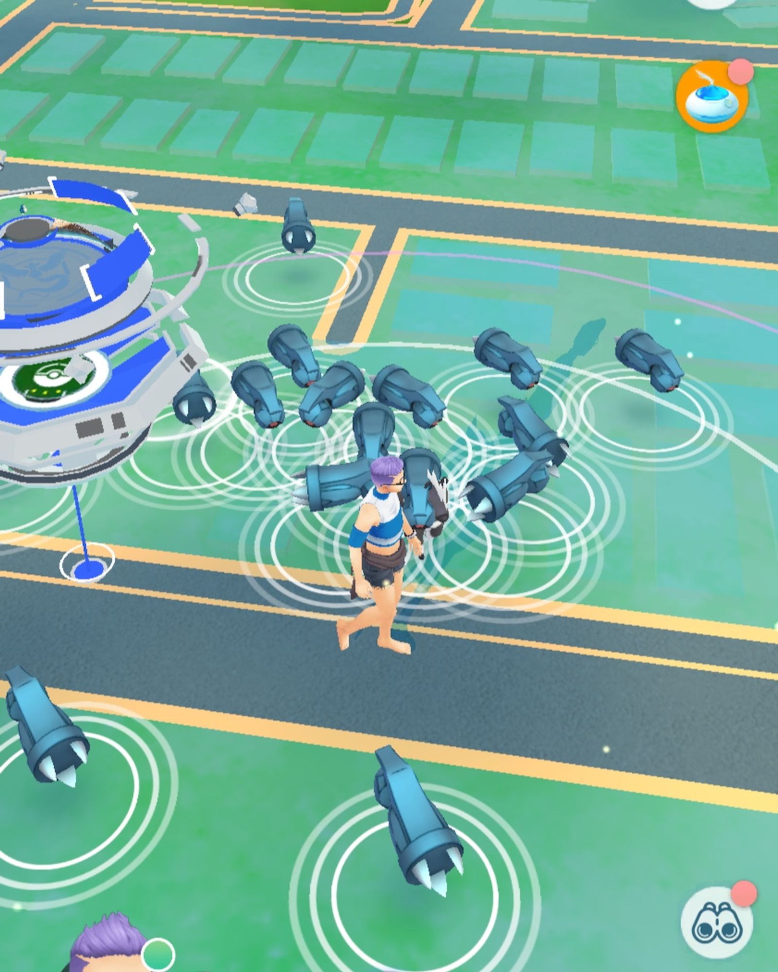 Screenshot of Pokémon GO, showing a swarm of Beldum in the area. Beldum's shape may be described as a horizontal shaft with a round head on one end.