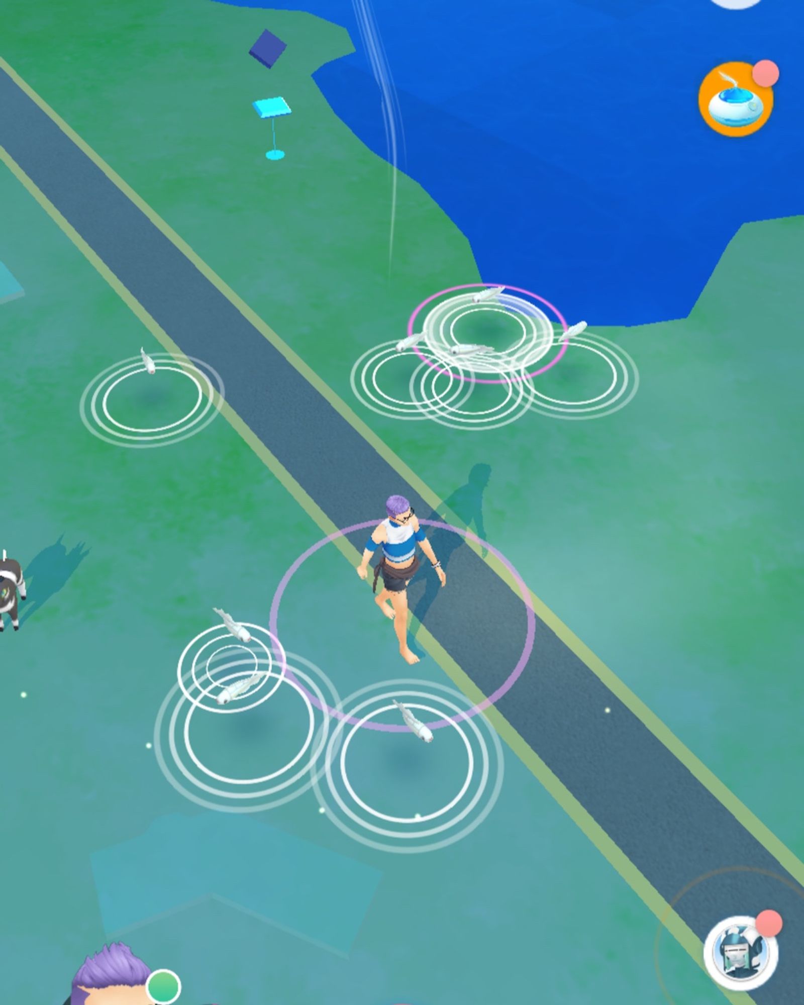 Screenshot of Pokémon GO, showing a group of Tynamo in the area. Though their design is based on tiny eels, their design may also appear somewhat like white tadpoles.