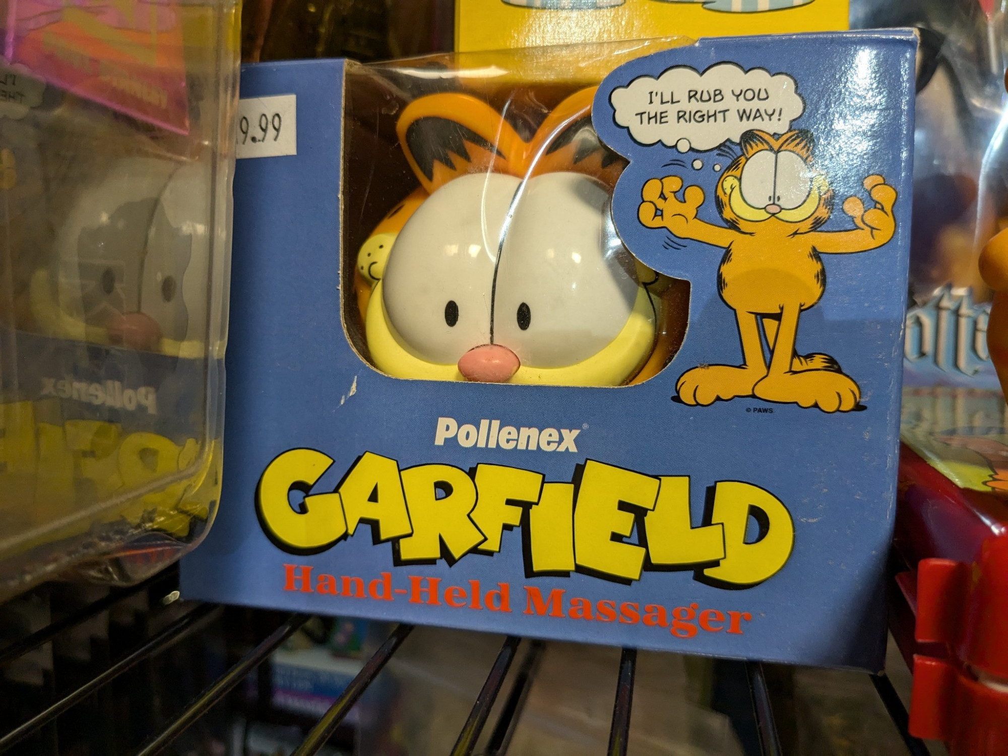 Boxed Garfield massager, with Garfield offering to rub you the right way.