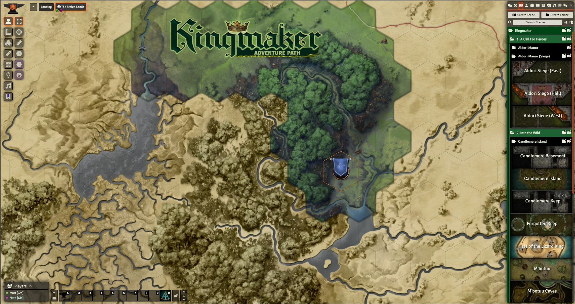 A screenshot depicting the Stolen Lands hex map from the Kingmaker module for Foundry VTT. A sepia toned low-detail version of the map is overlaid in the unexplored part of the map, while the explored part is vivid and colourful.