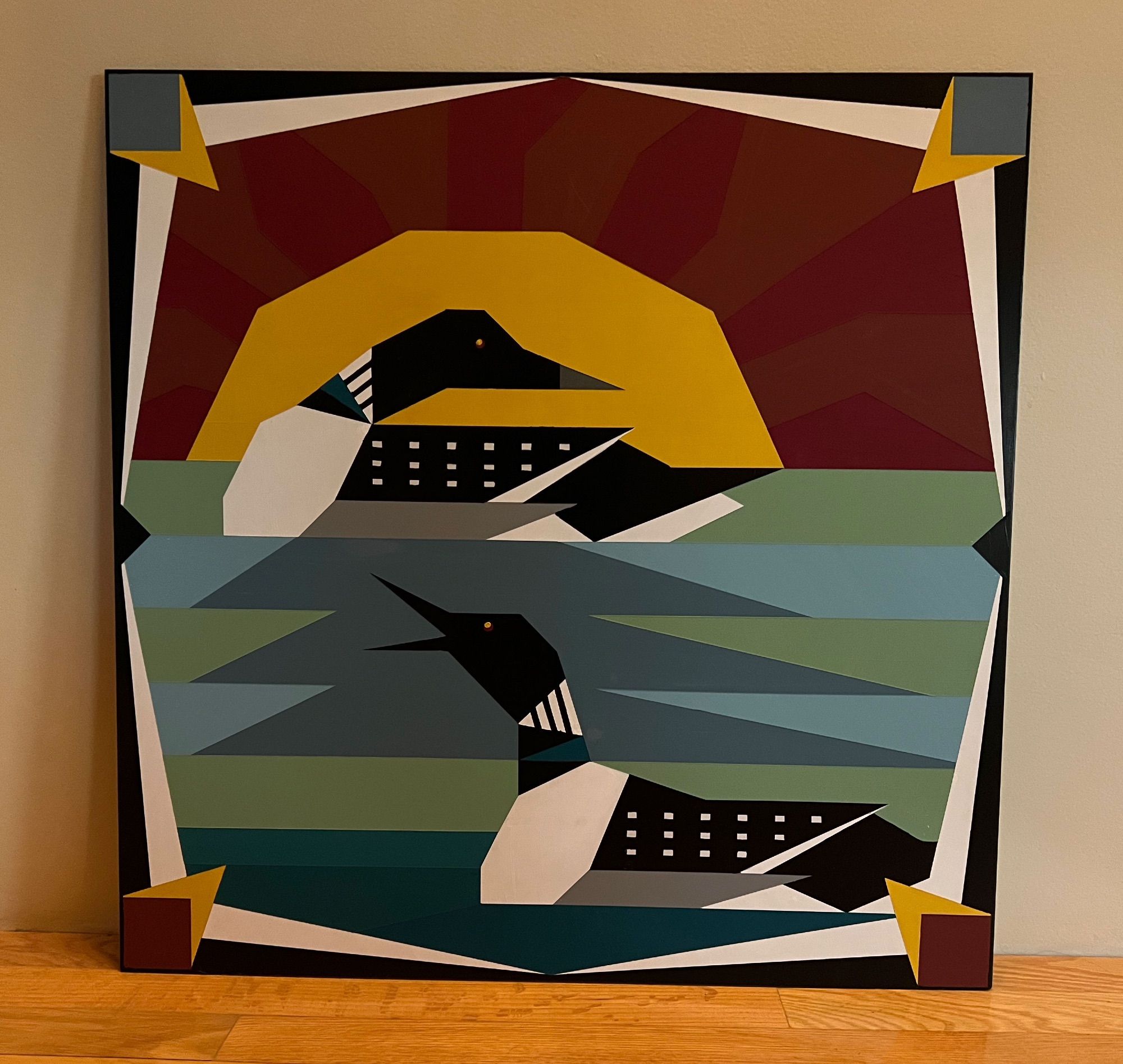 2X2 Barn Quilt painting of Laughing Loons swimming in a lake with a giant sunset in the background.