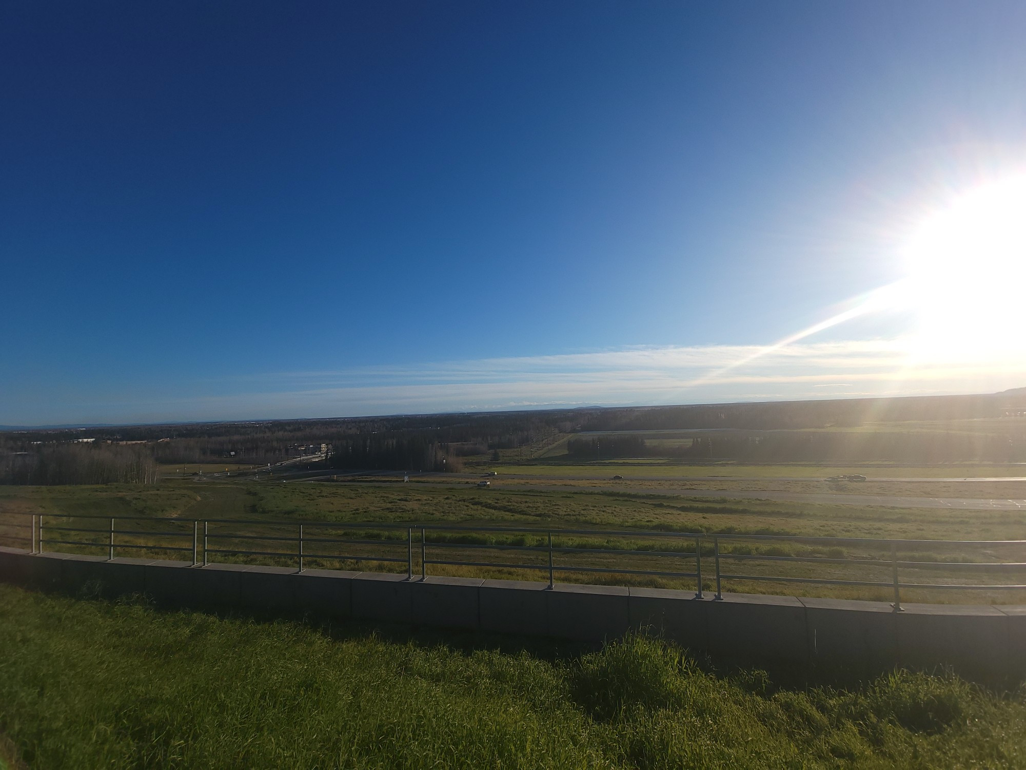 A wide angle view of the same shot in panorama view earlier. Some clouds are visible low on the horizon on this shot.