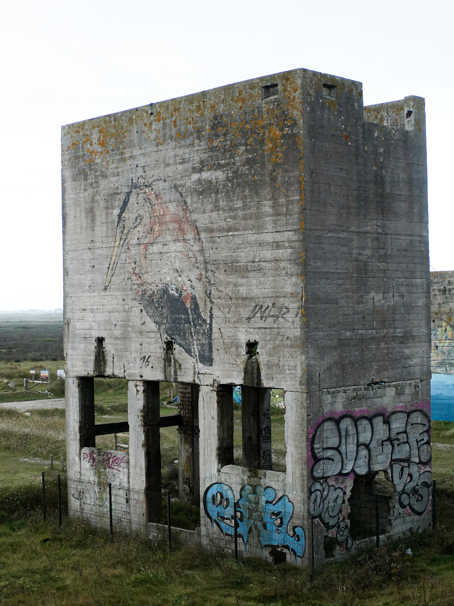 Detail of the eastern side of one of the hoppers. The figure of a large grey heron is painted on its side.