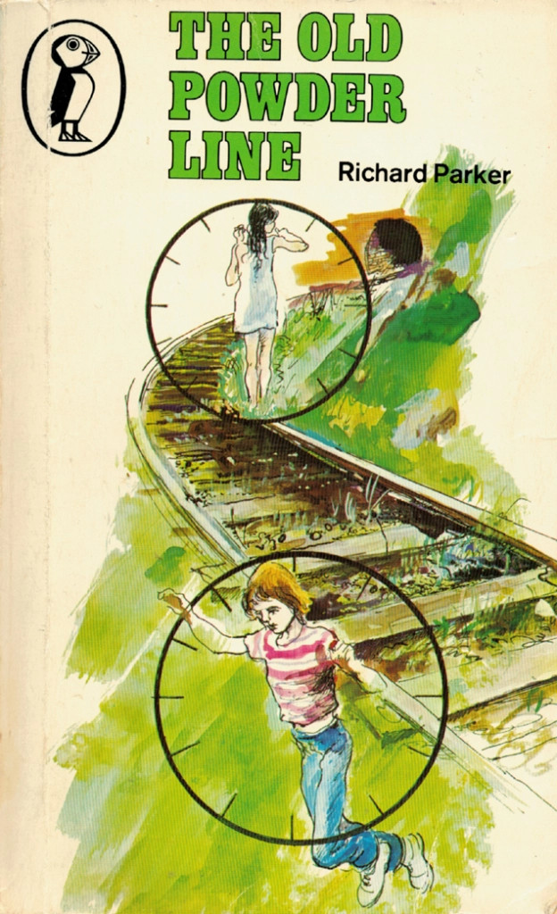 The book cover which has an illustration of two teenagers, one male one female, on a railway line. A tunnel can be seen in the distance. Lots of green used in the image.