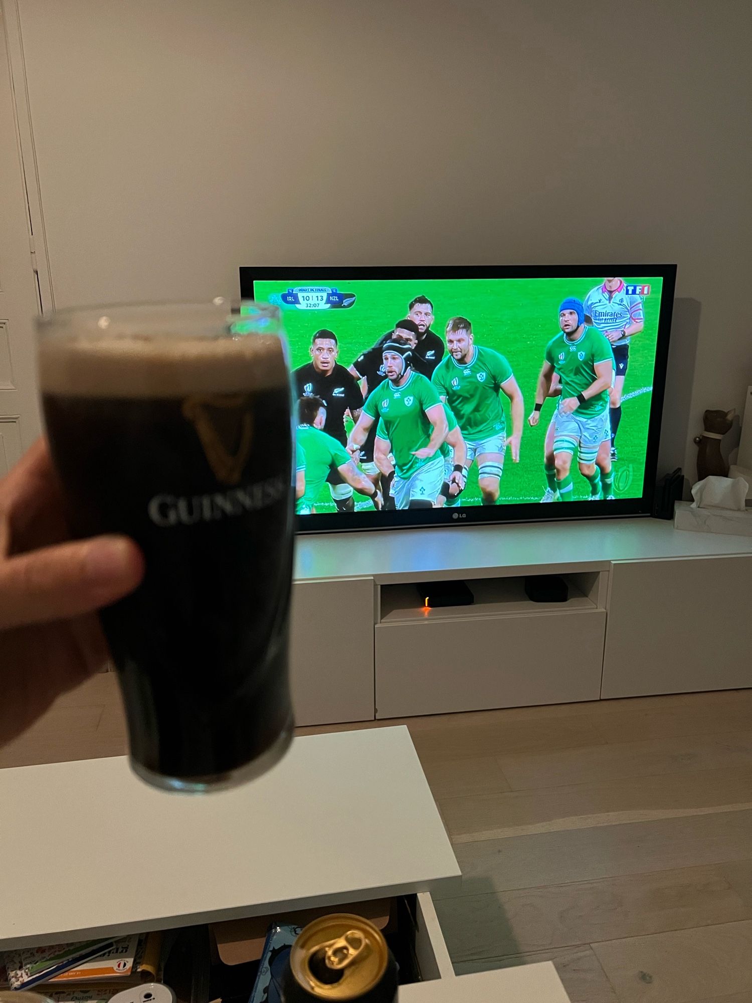 The Ireland VS NewZeland rugby world cup match with a pint of Guinness in the foreground.