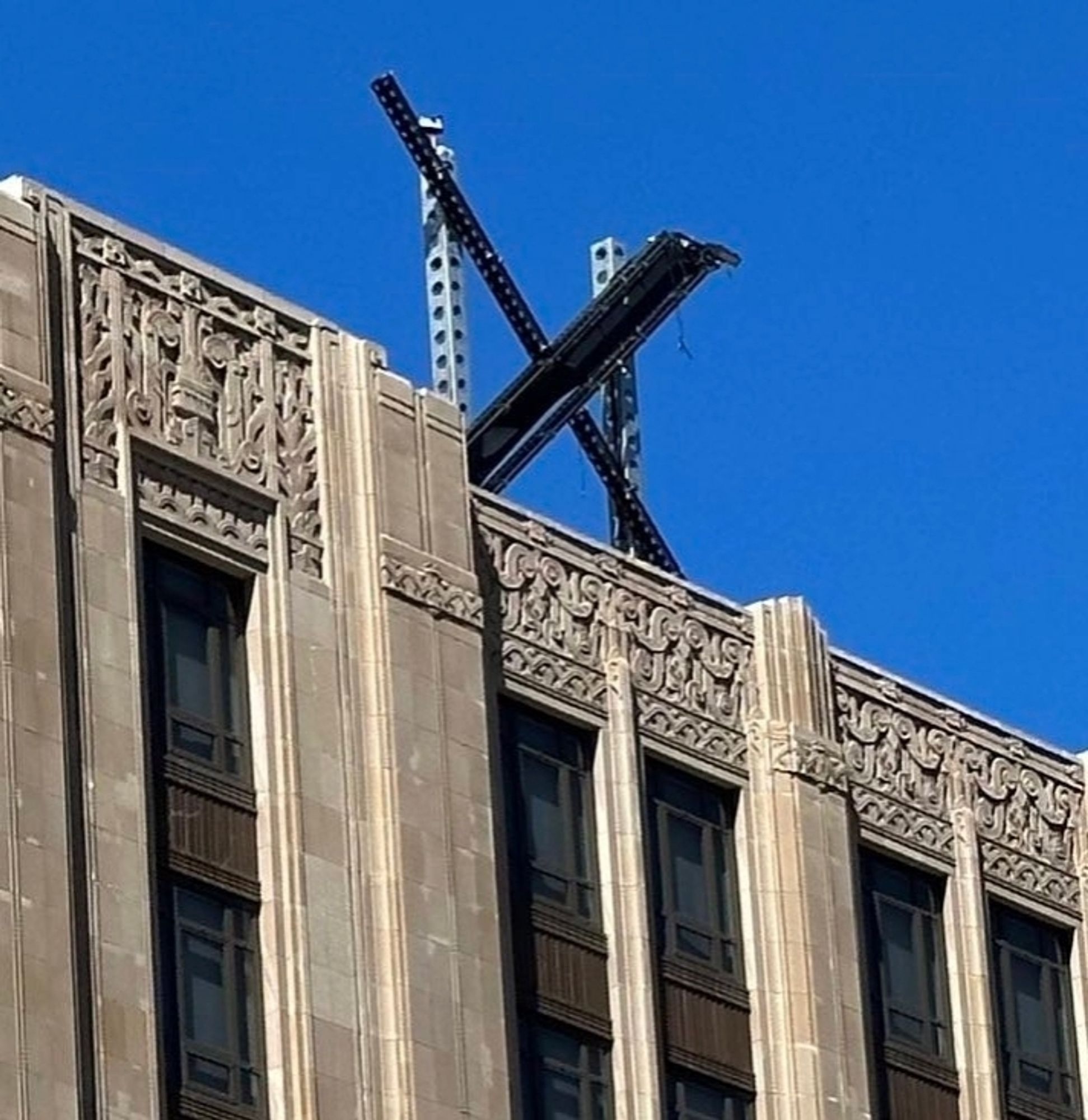 the annoying dorky x logo on the twitter building