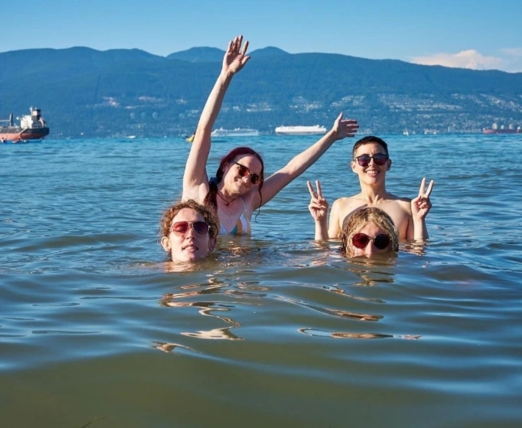 a group of absolute dorks floating in a beautiful ocean