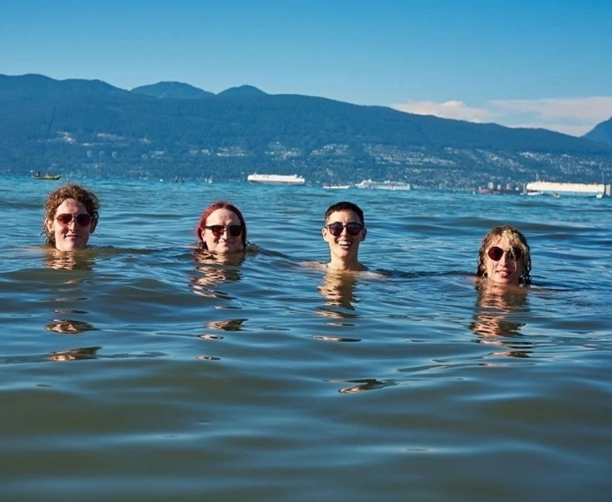 a group of hotties floating in a beautiful ocean